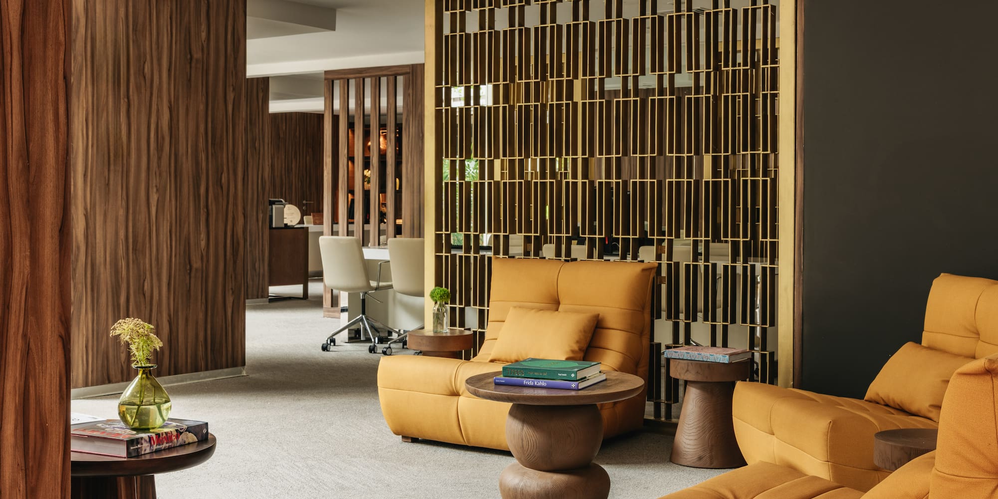 a beach with straw umbrellas and a building in the background