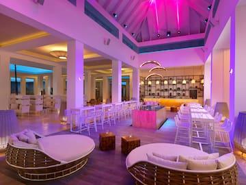 a room with chairs and tables