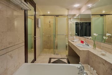 a bathroom with a bathtub and shower