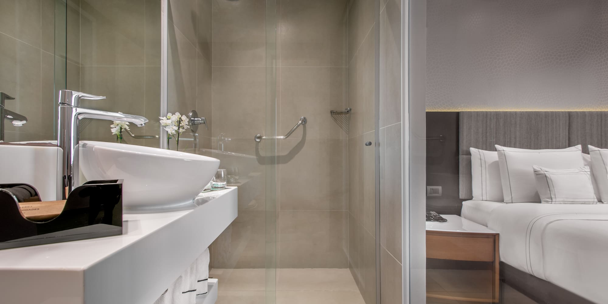 a bathroom with a glass shower door