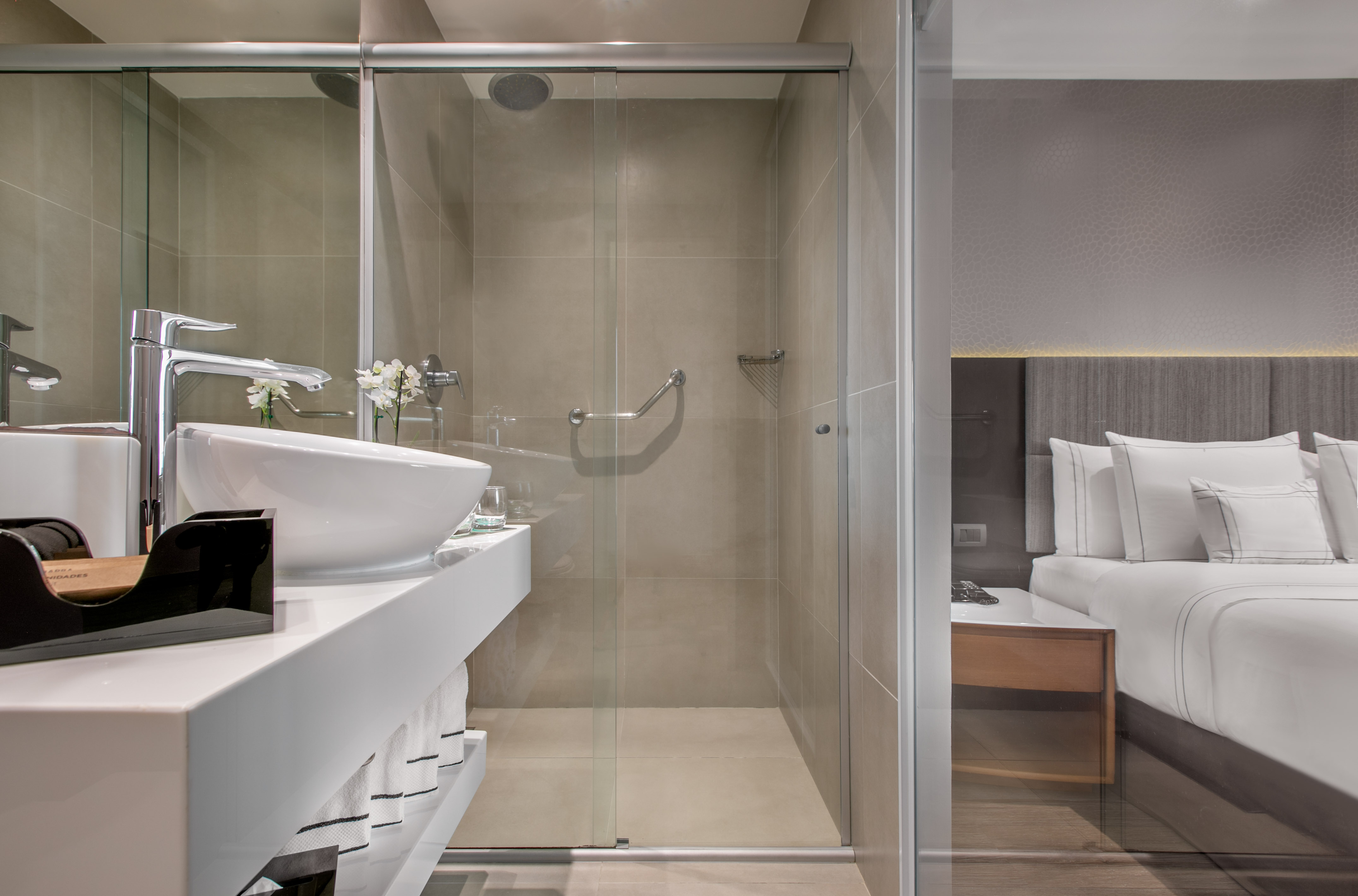 a bathroom with a glass shower door