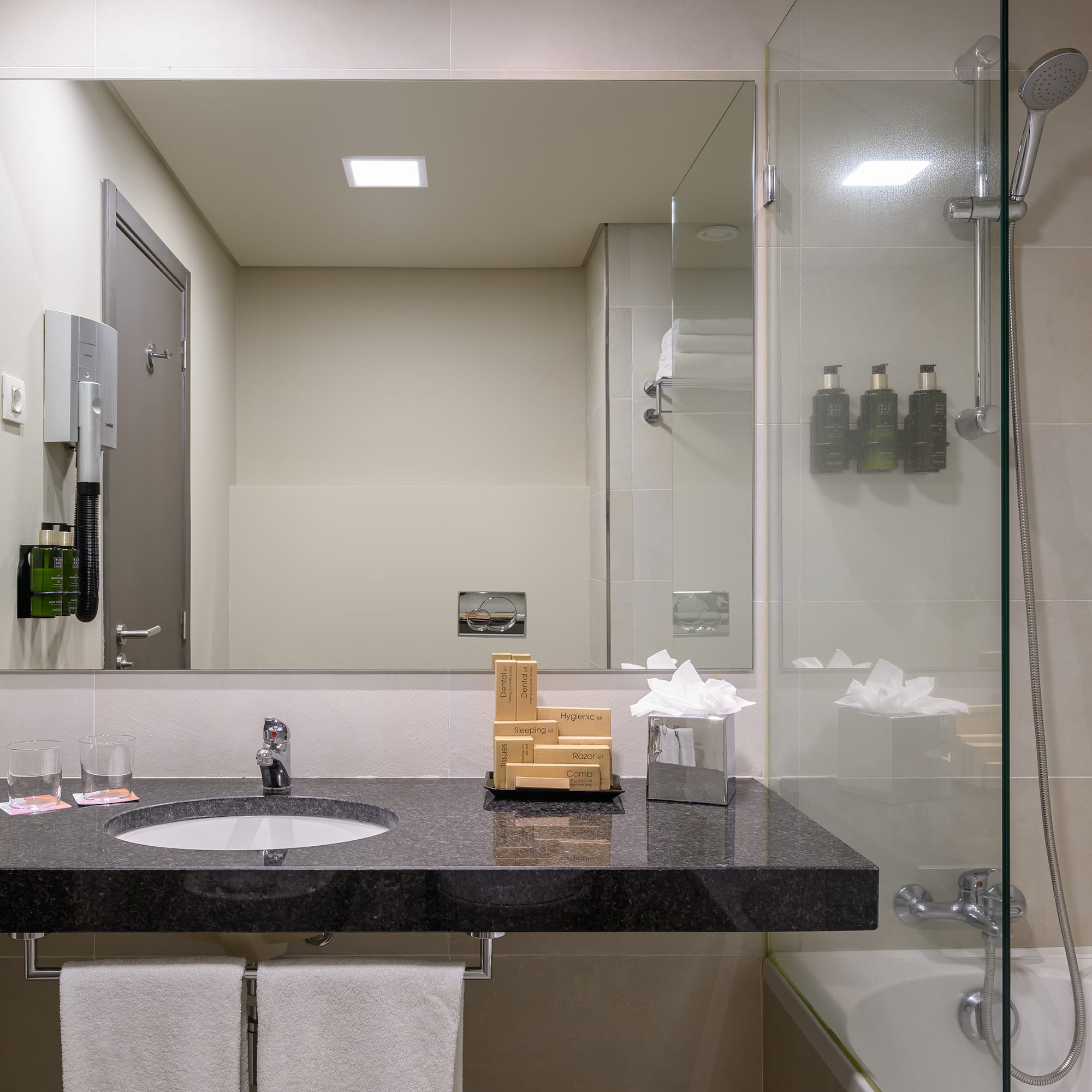 a bathroom with a sink and a shower