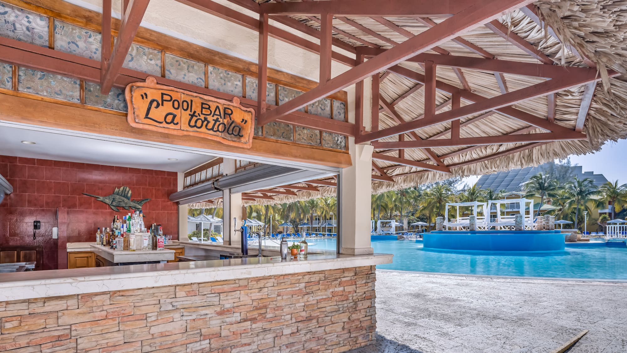 a pool bar with a pool in the background