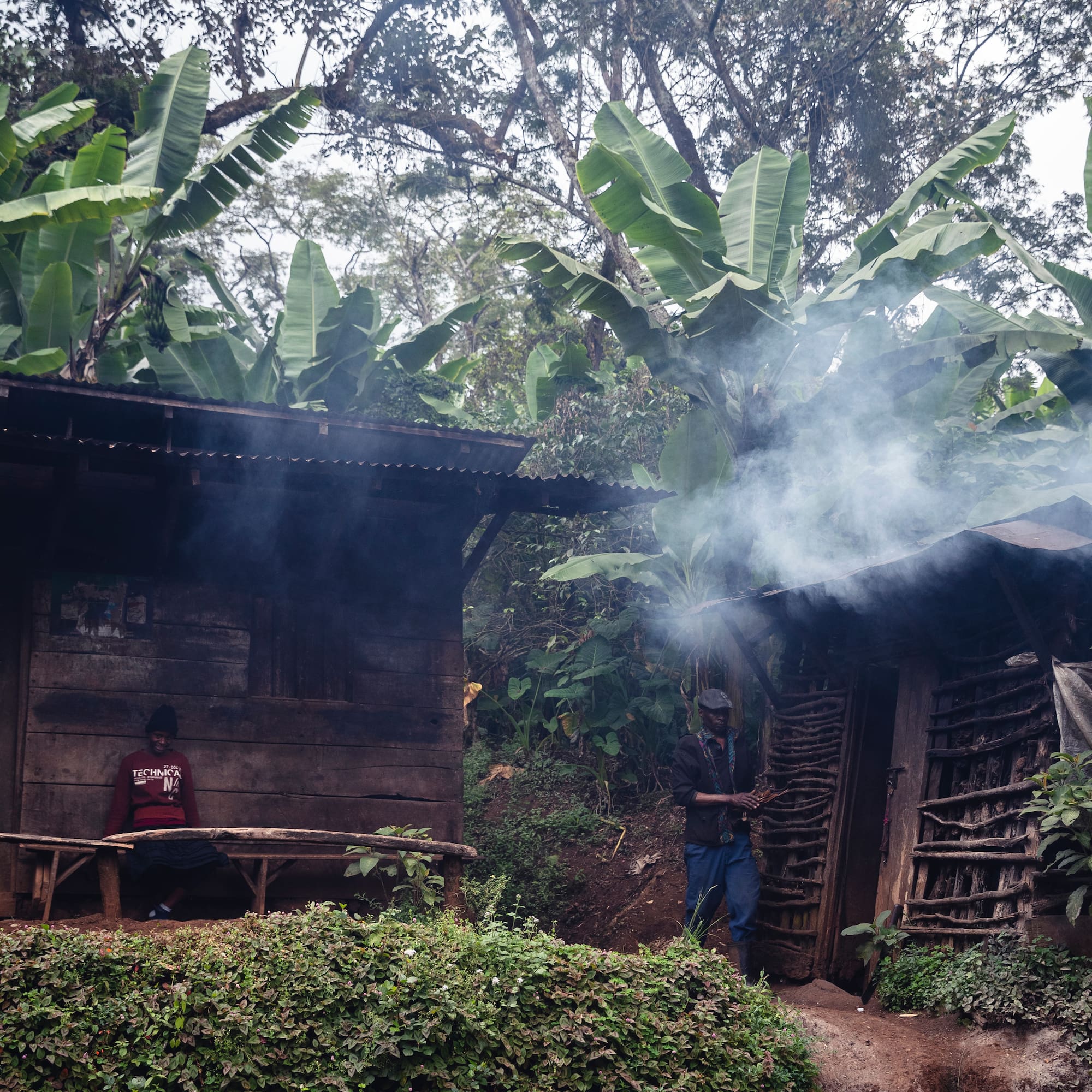 two people standing outside a building