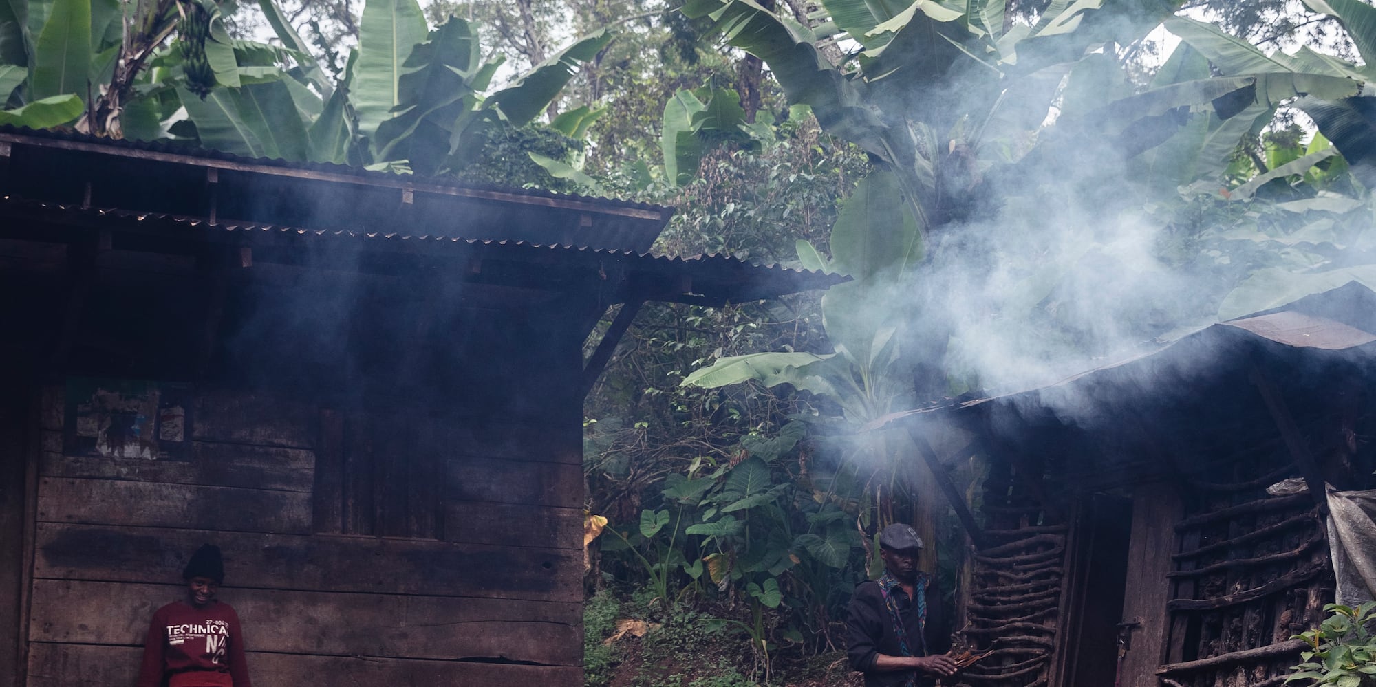 two people standing outside a building