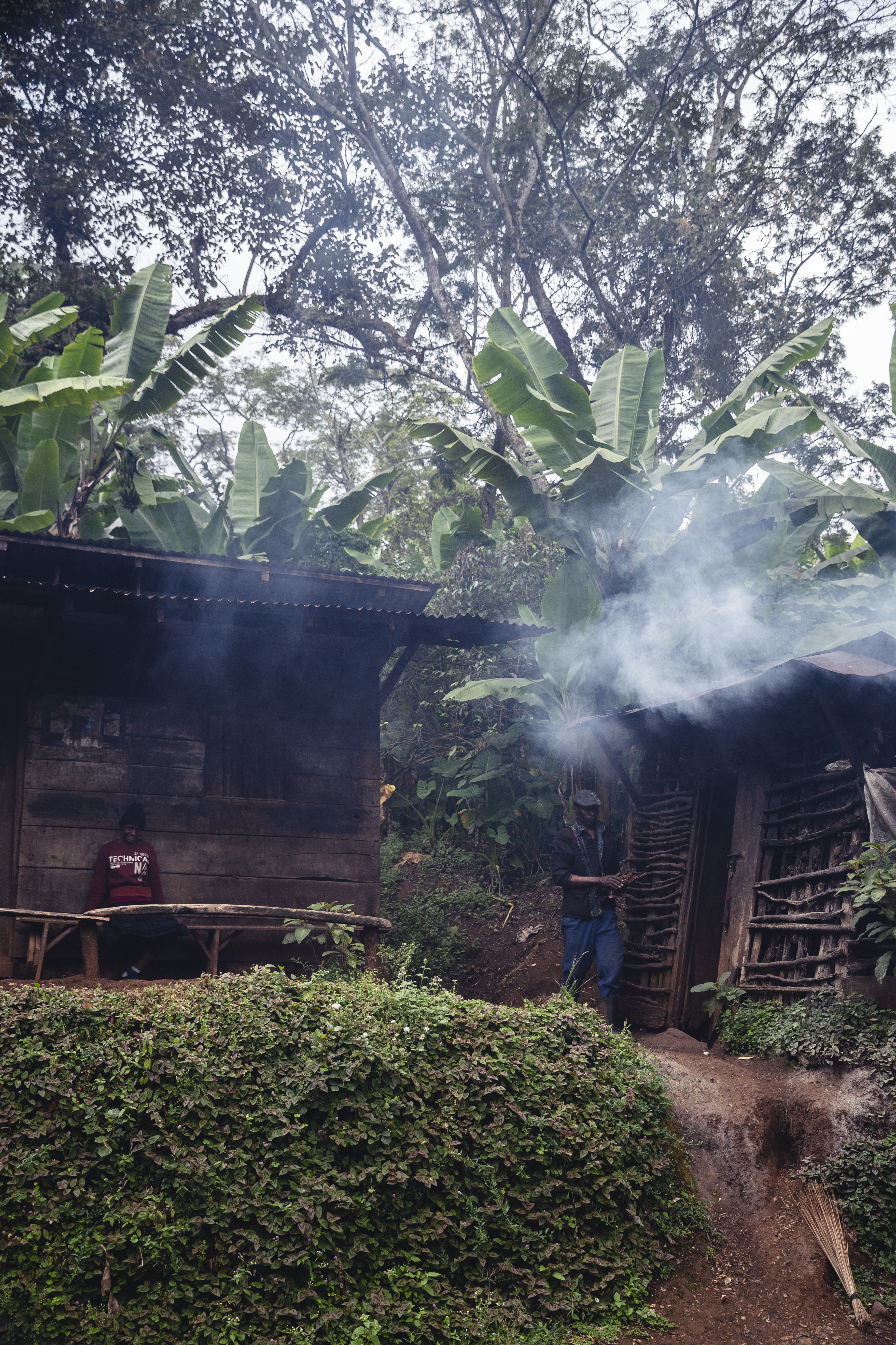 two people standing outside a building