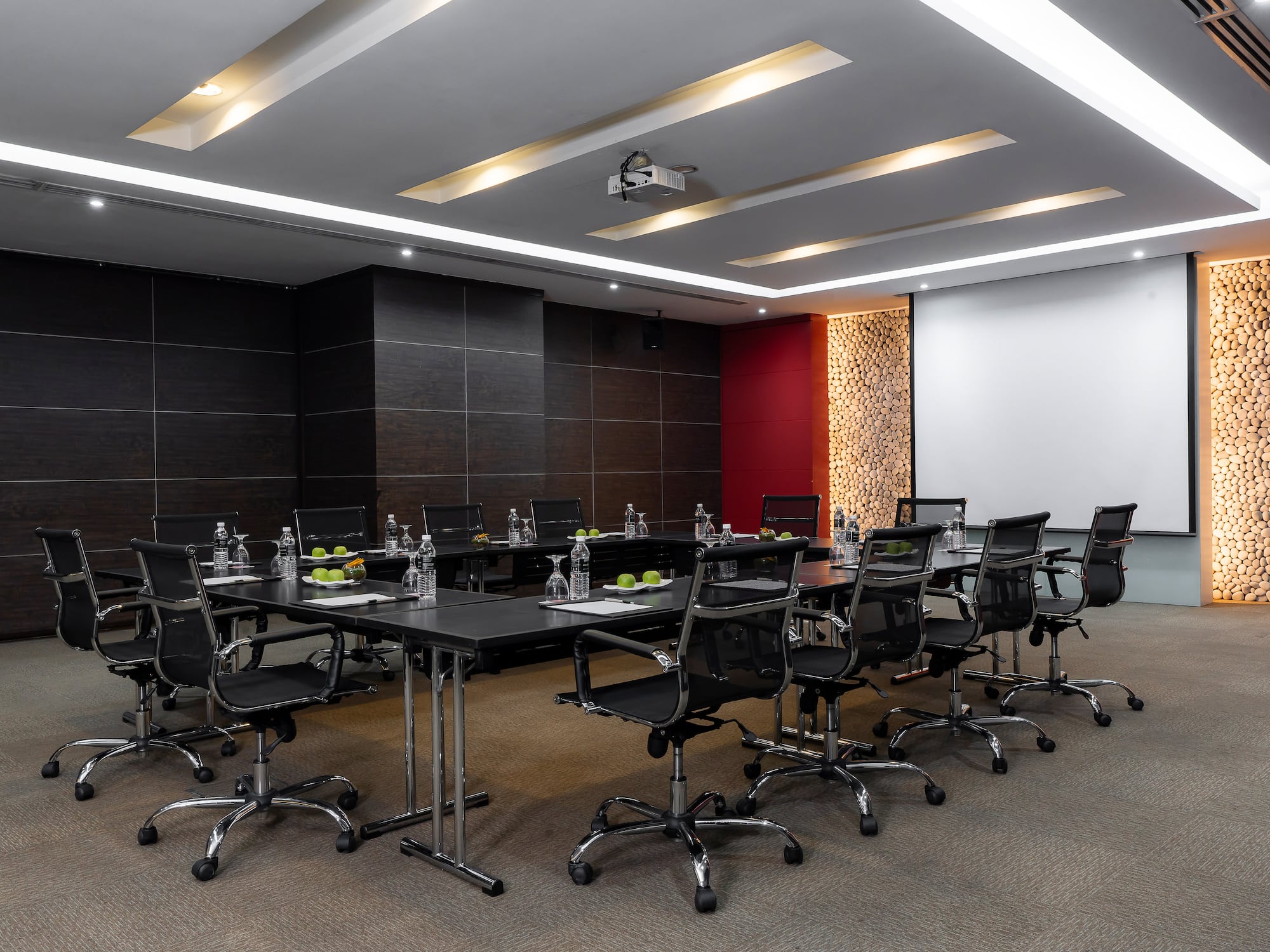a conference room with a table and chairs