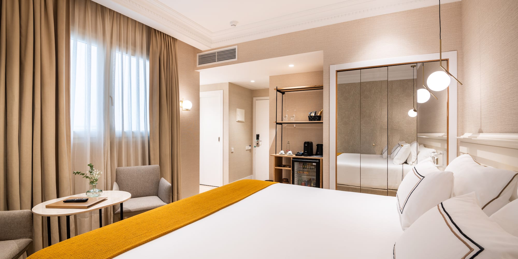 a room with a bed and a mirror