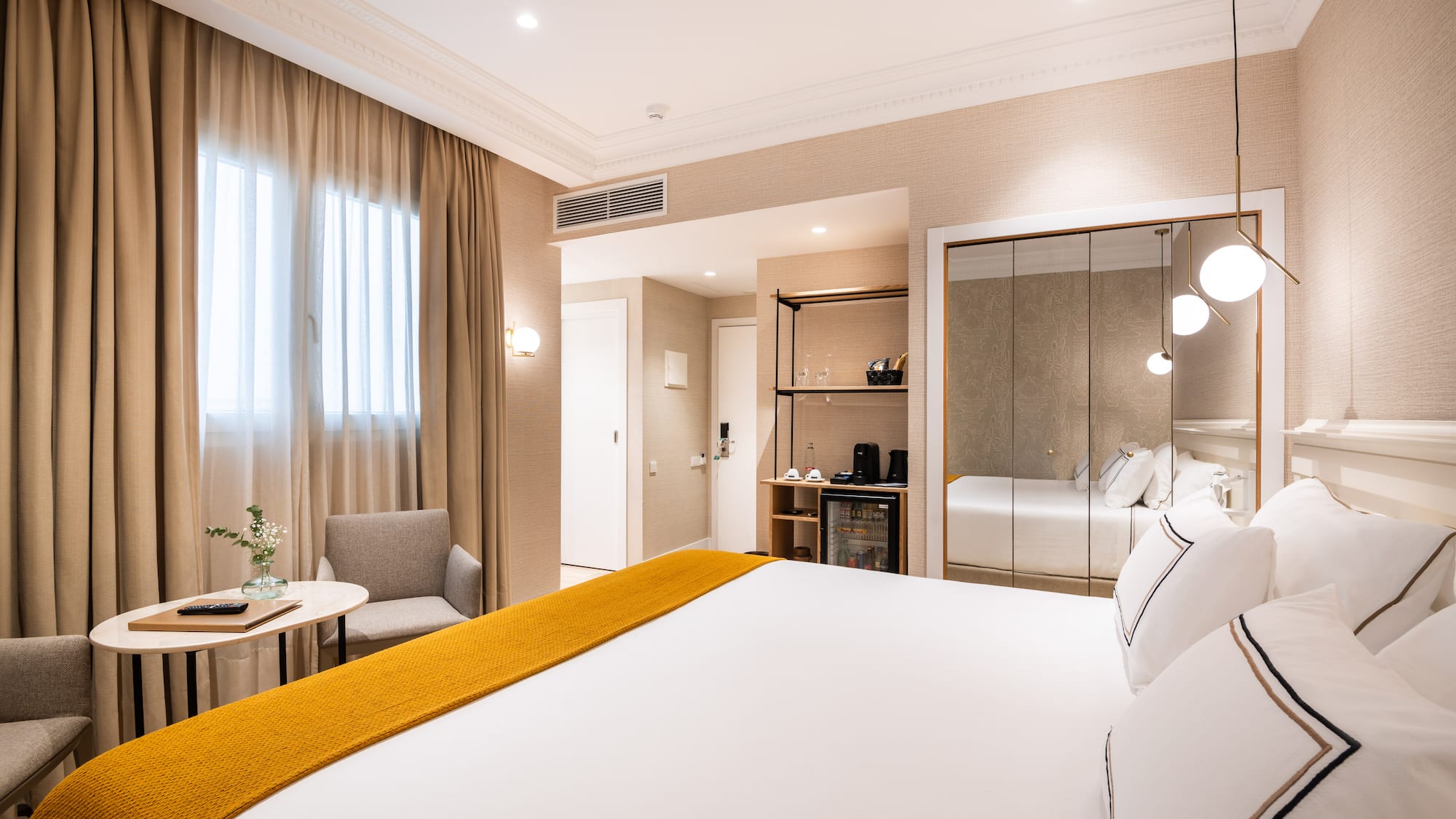 a room with a bed and a mirror