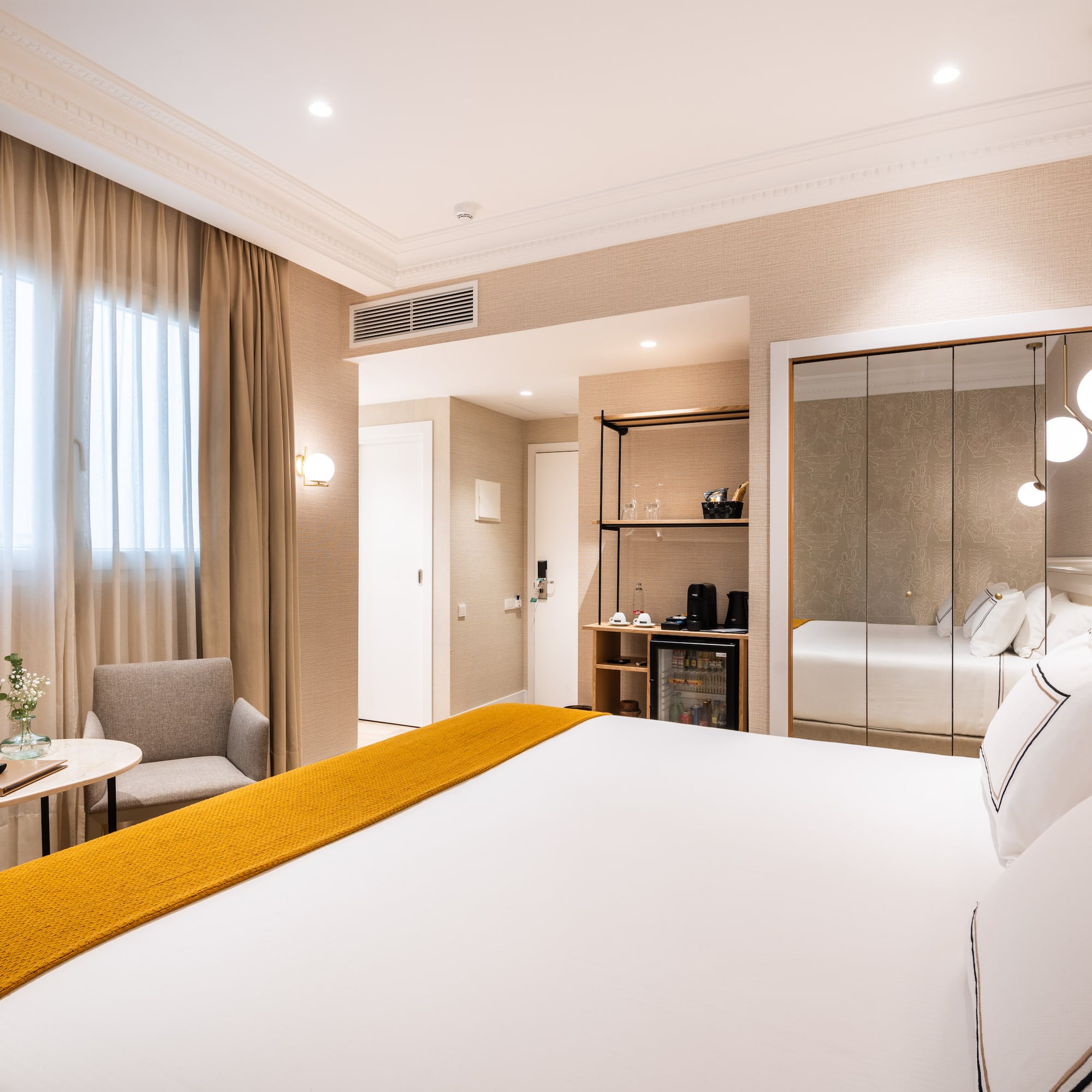 a room with a bed and a mirror