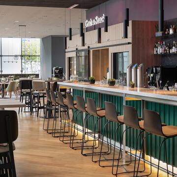 a bar with chairs and tables