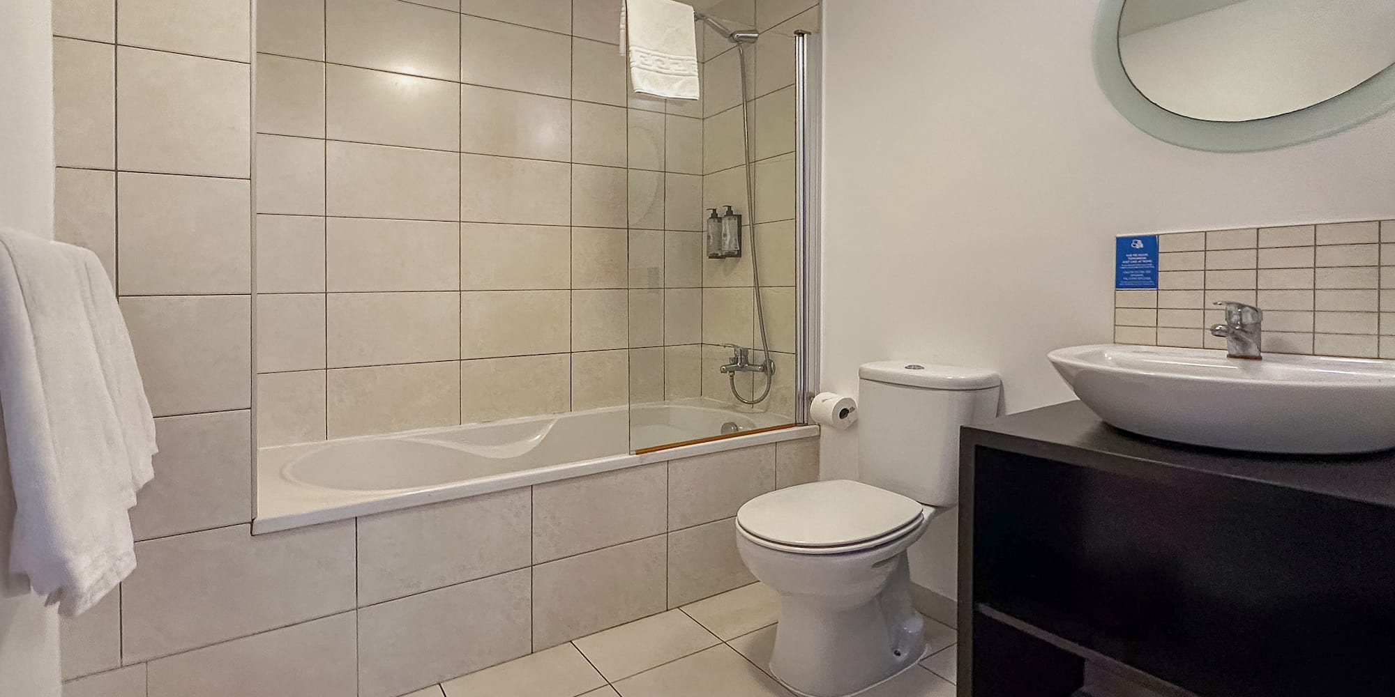 a bathroom with a tub and toilet
