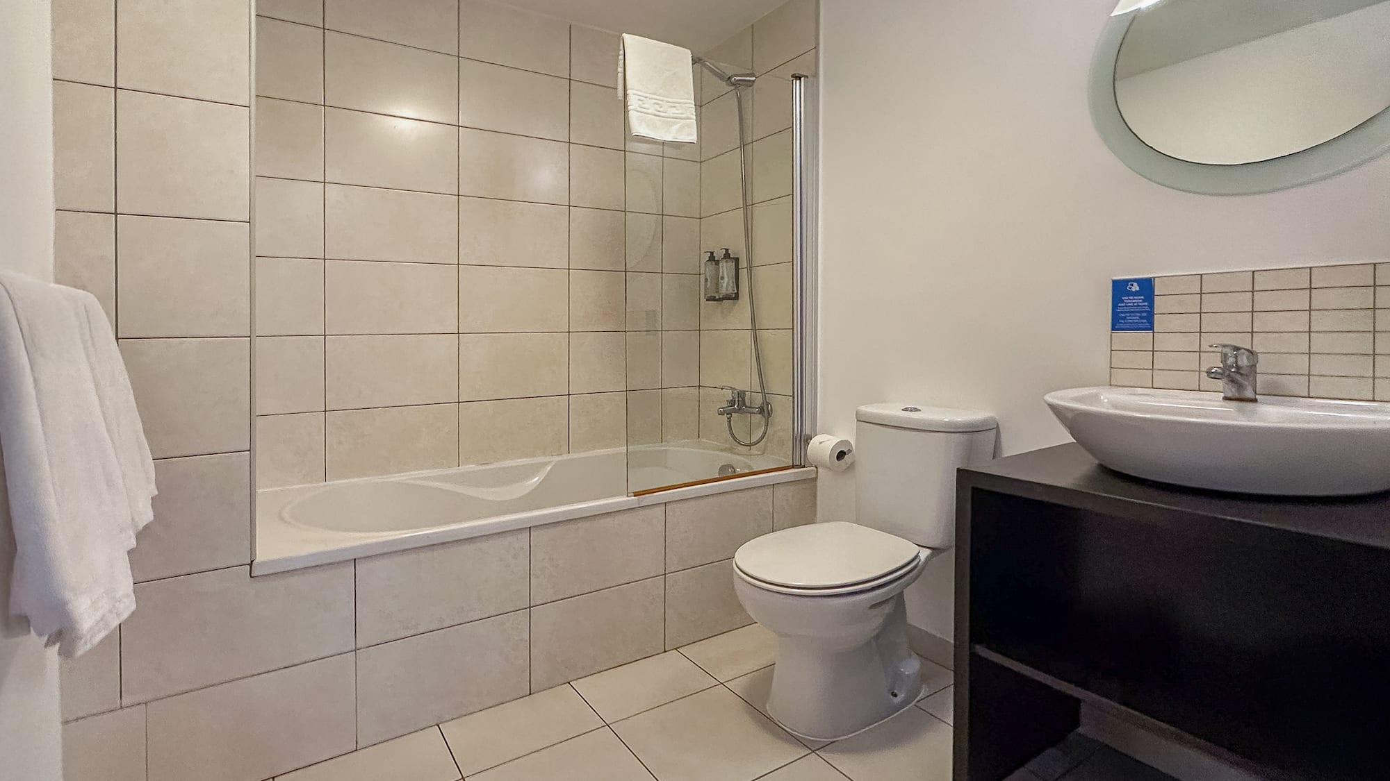 a bathroom with a tub and toilet