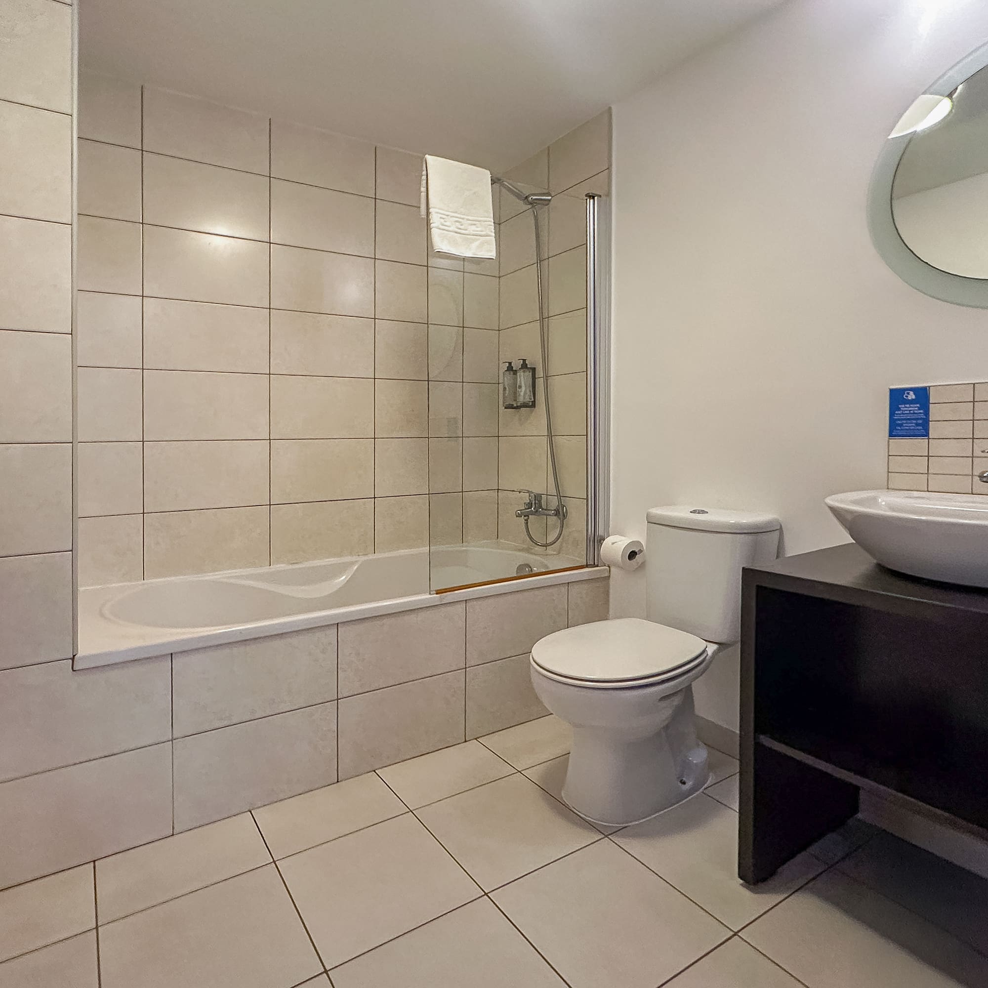 a bathroom with a tub and toilet