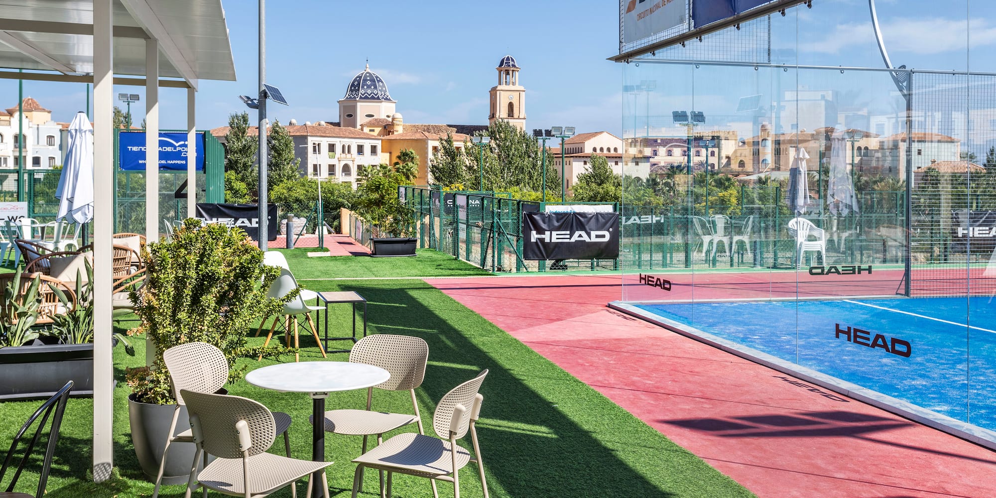 a pool and tables with chairs