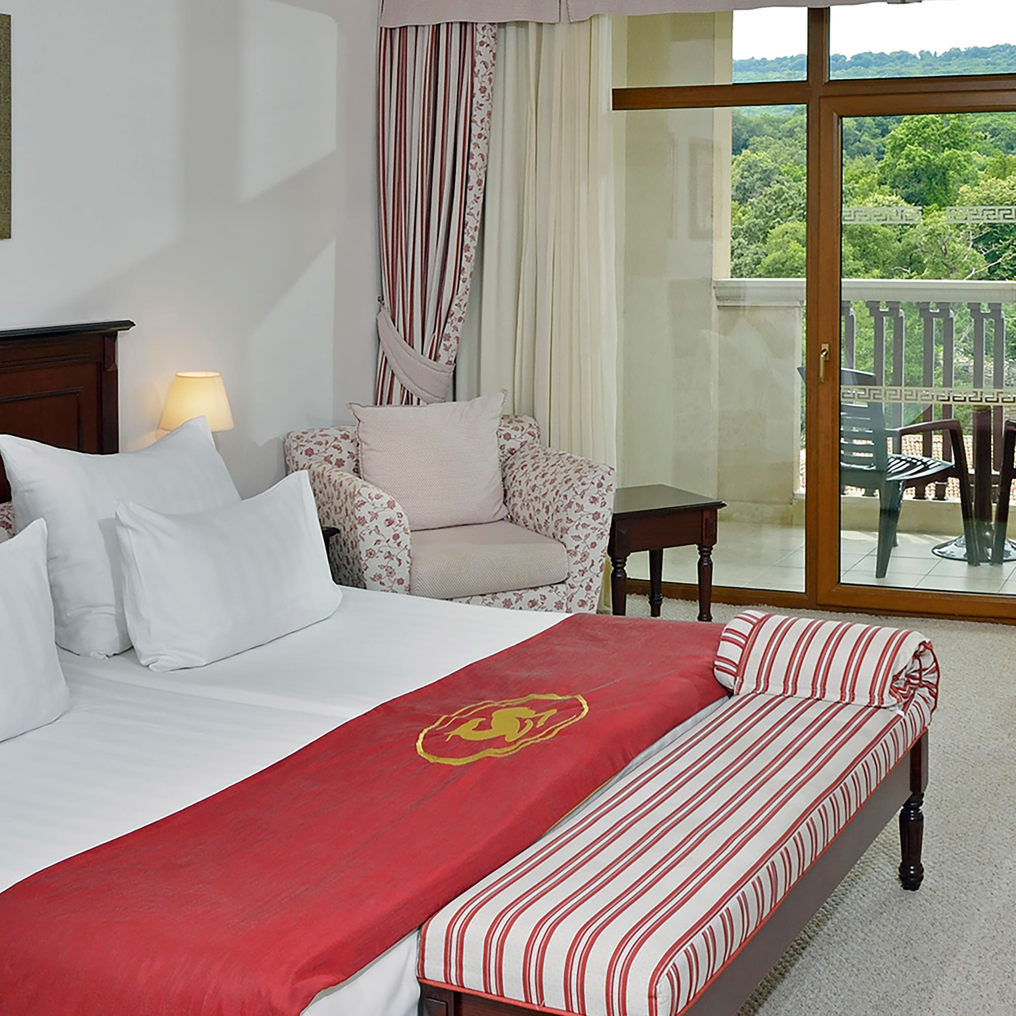 a hotel room with a bed and a chair