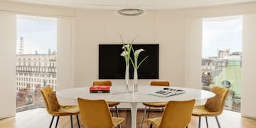 a room with a table and chairs