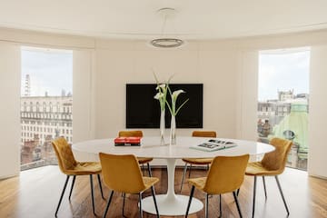 a room with a table and chairs