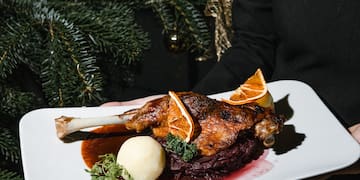 a person holding a plate of food