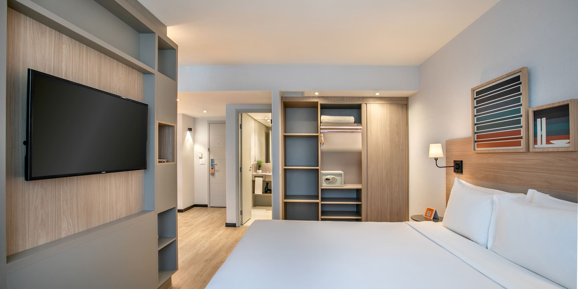 a room with a bed and a tv