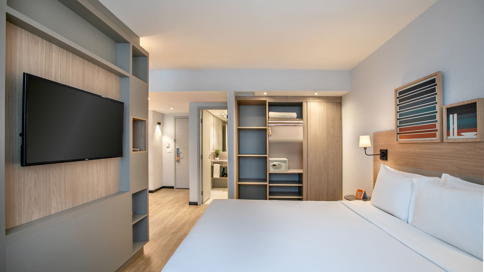 a room with a bed and a tv