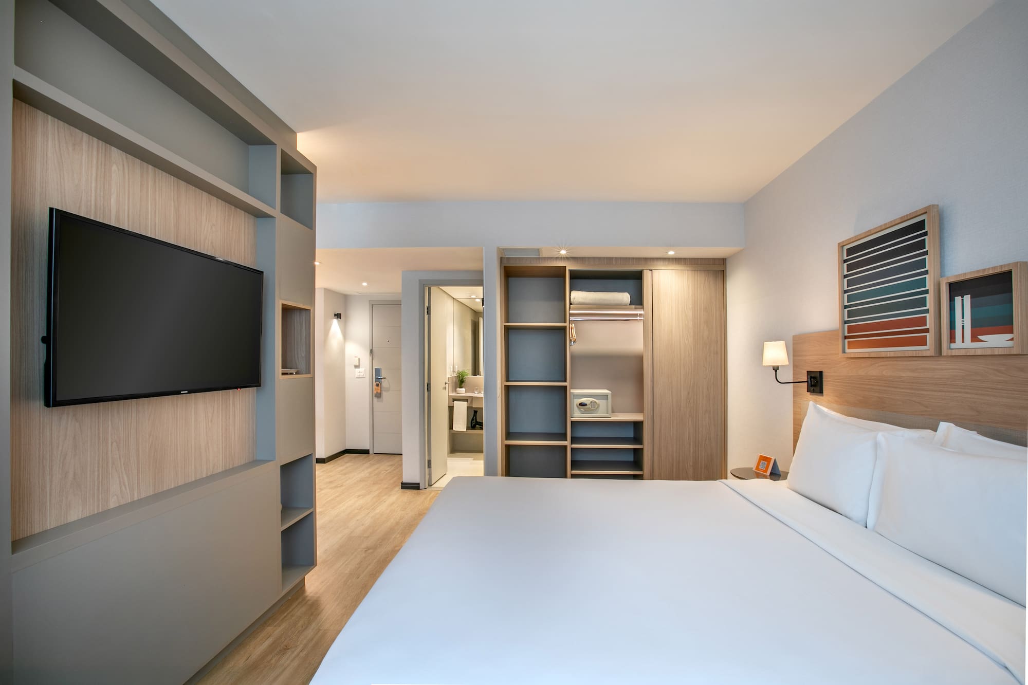 a room with a bed and a tv