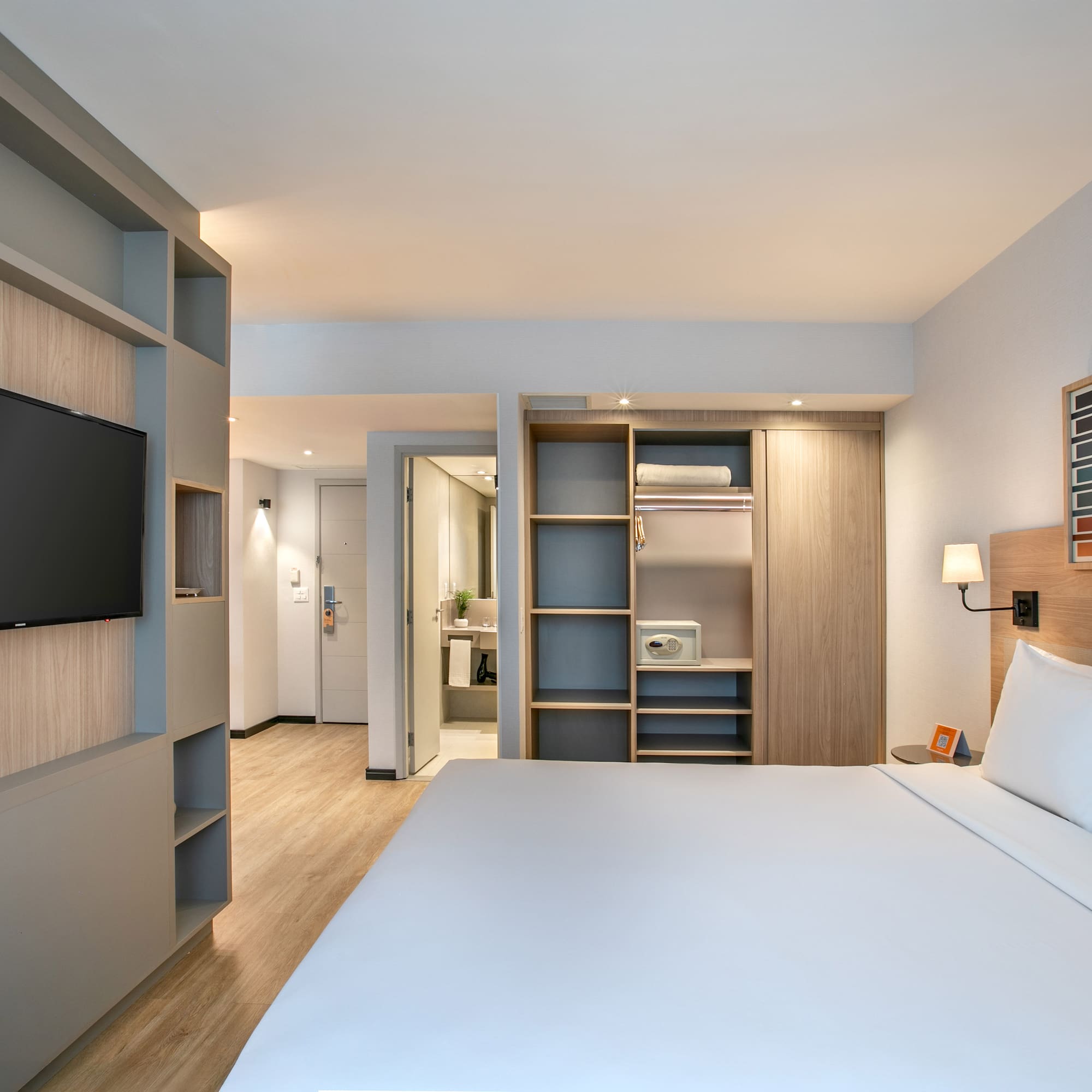 a room with a bed and a tv