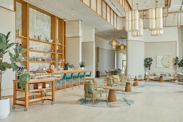 a room with a bar and chairs