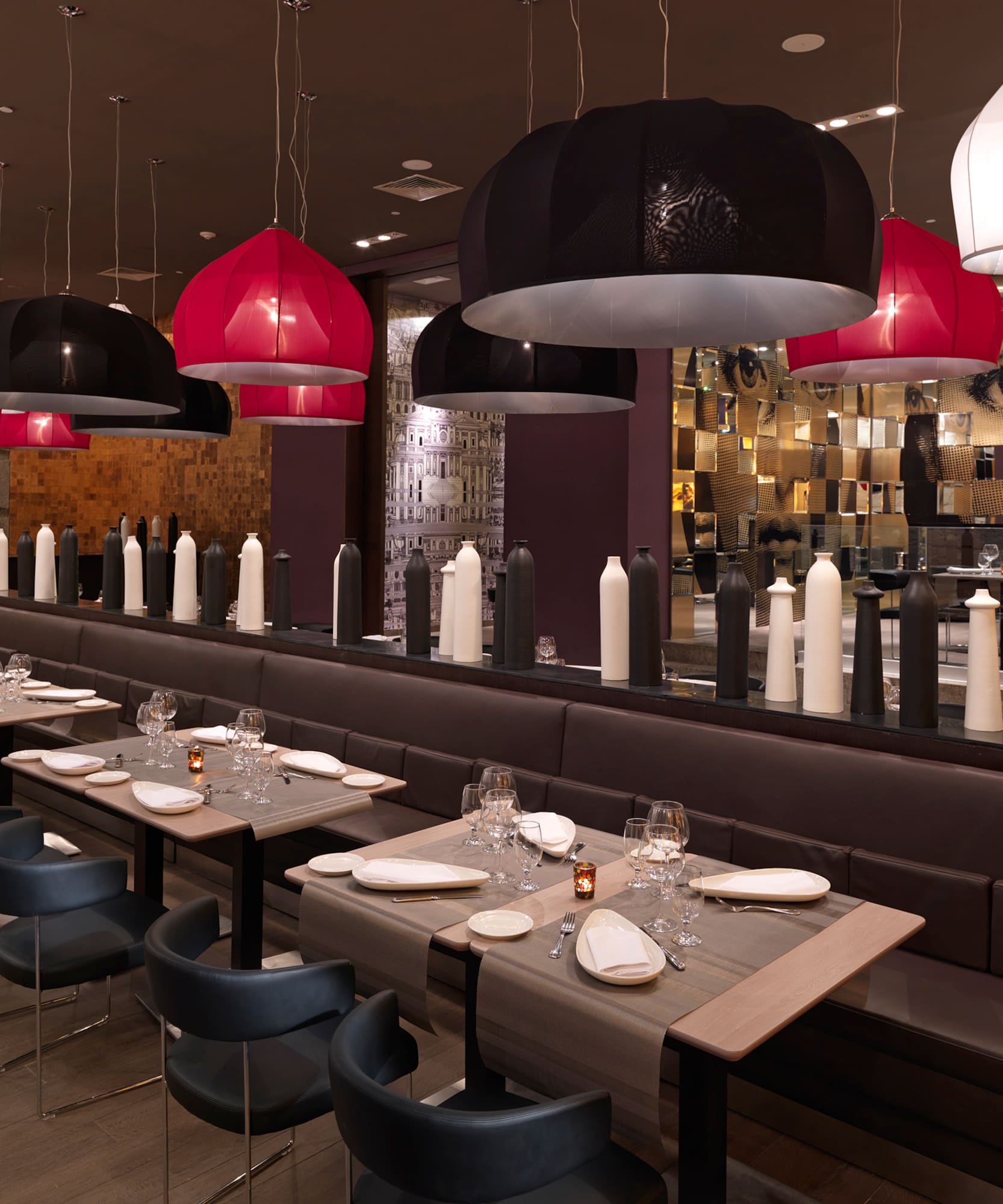 a long table with chairs and tables in a restaurant