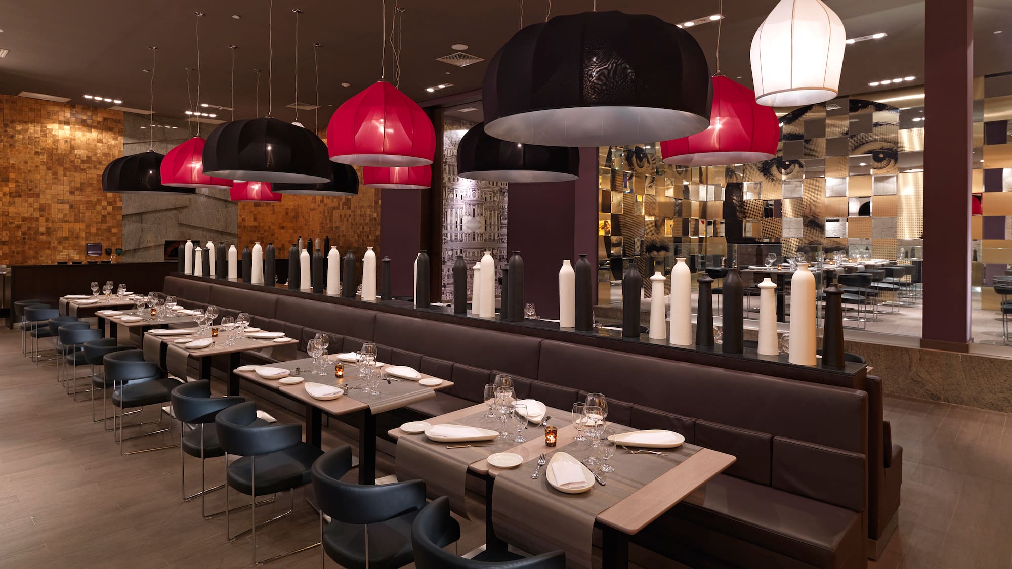a long table with chairs and tables in a restaurant