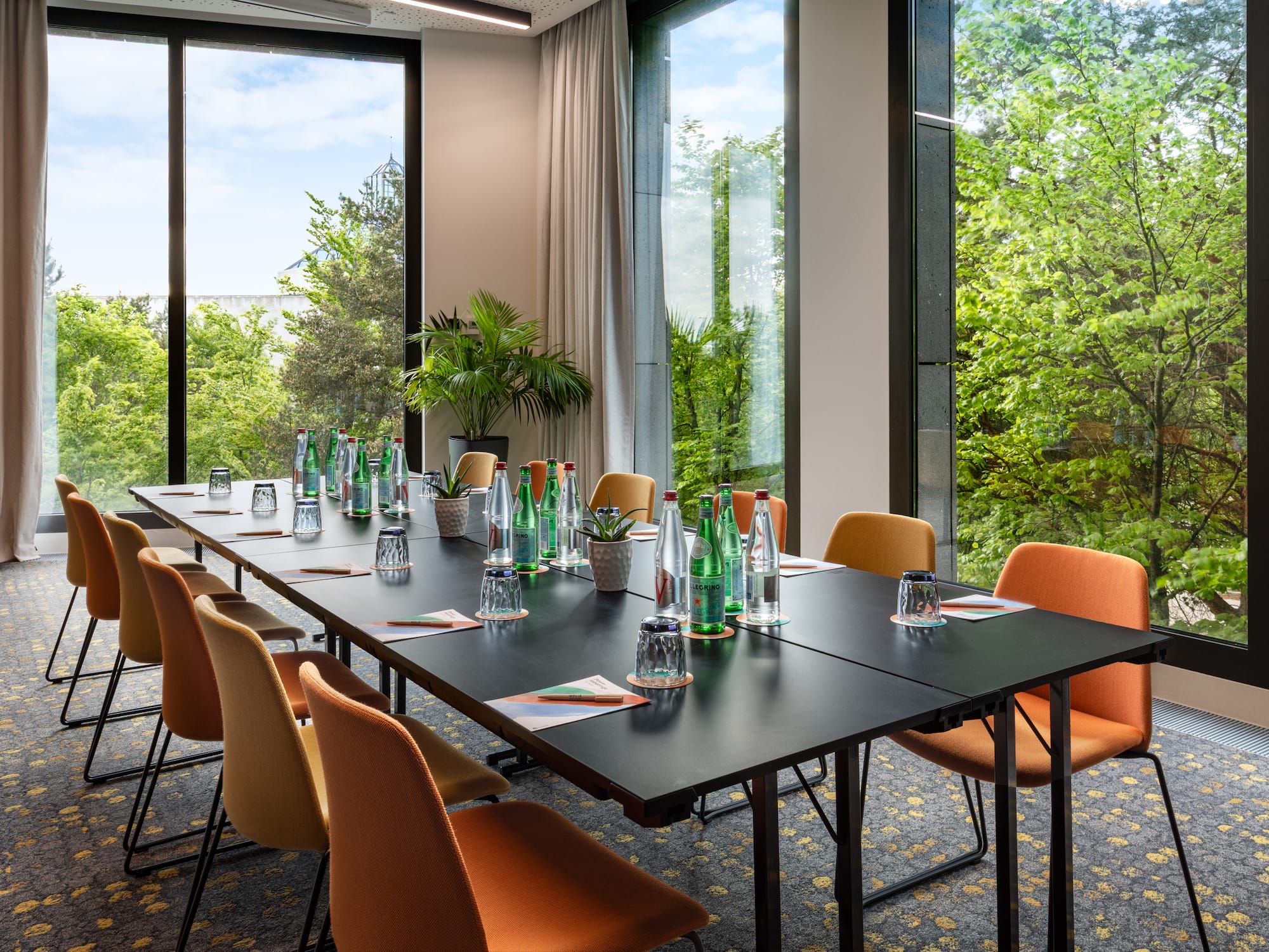 a conference room with a table and chairs