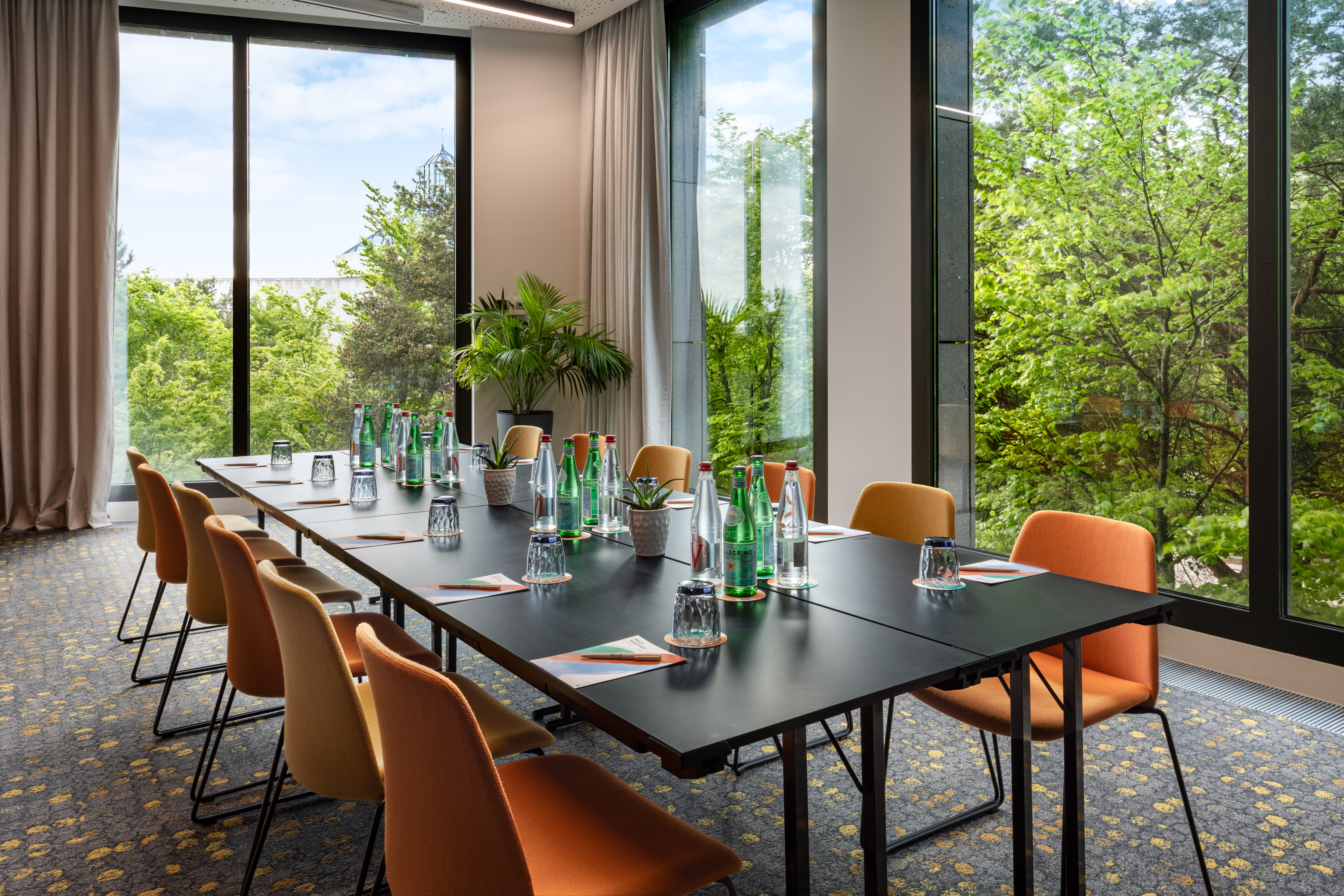 a conference room with a table and chairs