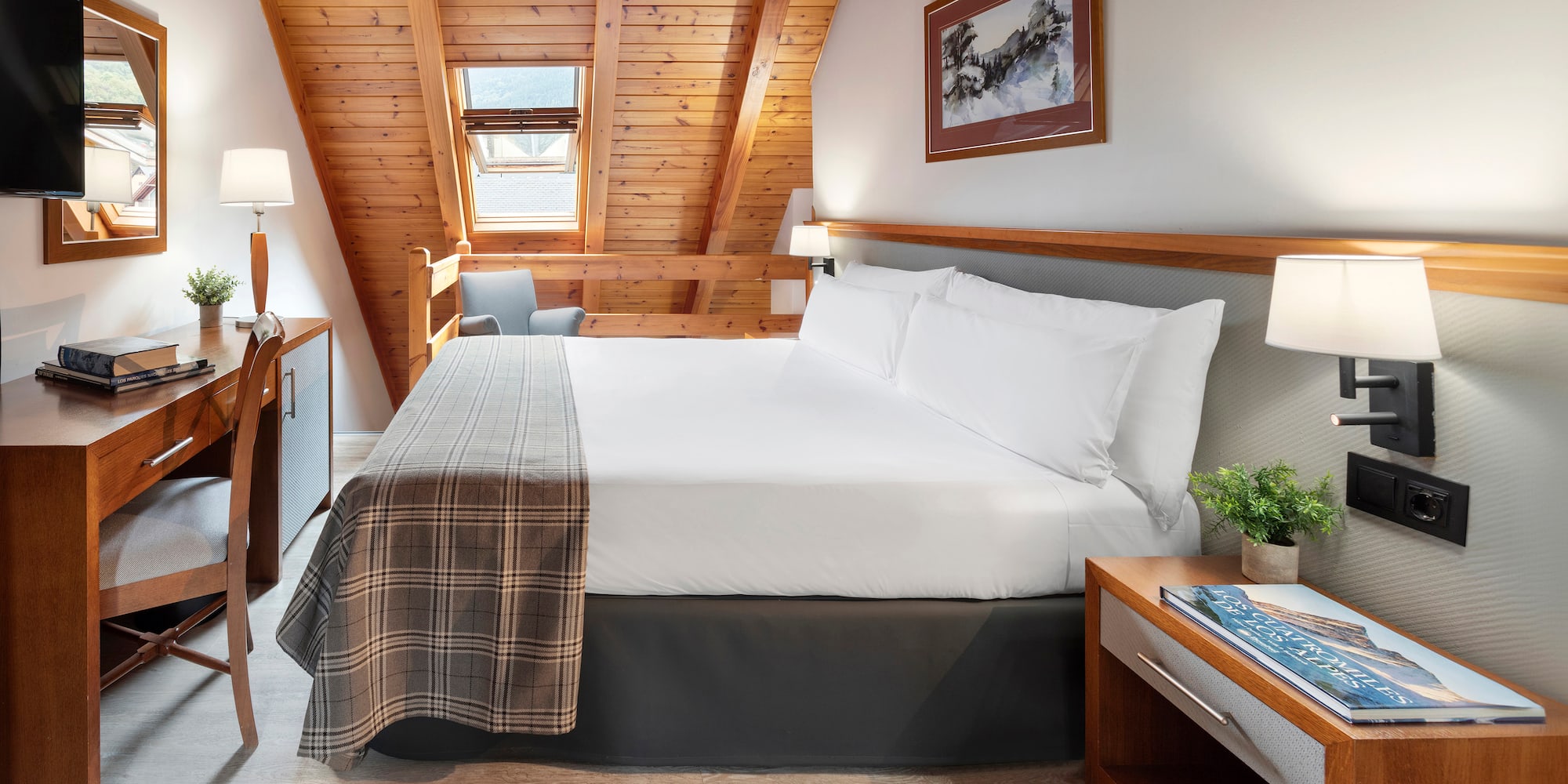 a bedroom with a bed and a desk