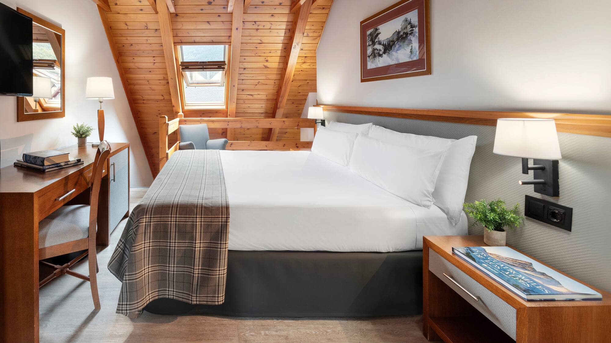 a bedroom with a bed and a desk