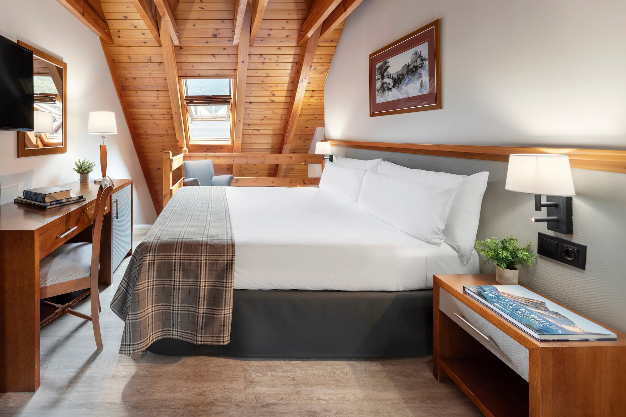 a bedroom with a bed and a desk