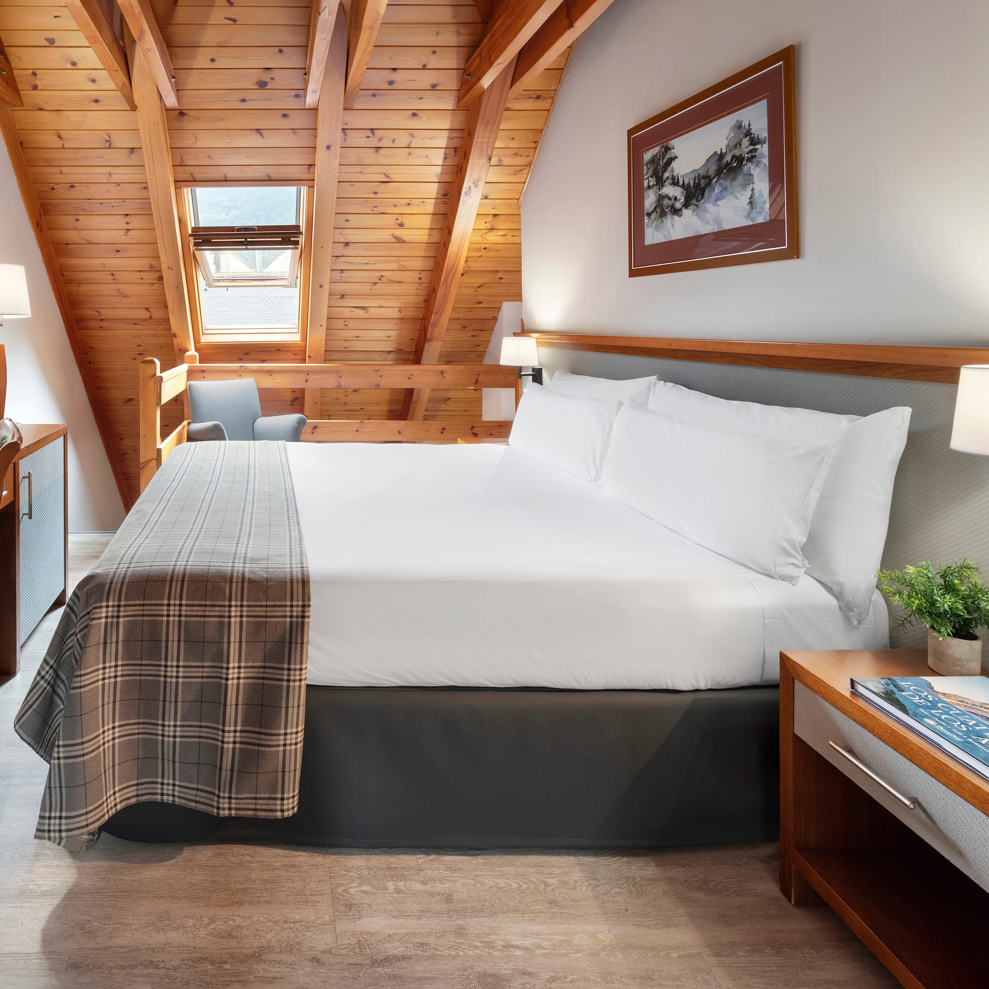 a bedroom with a bed and a desk