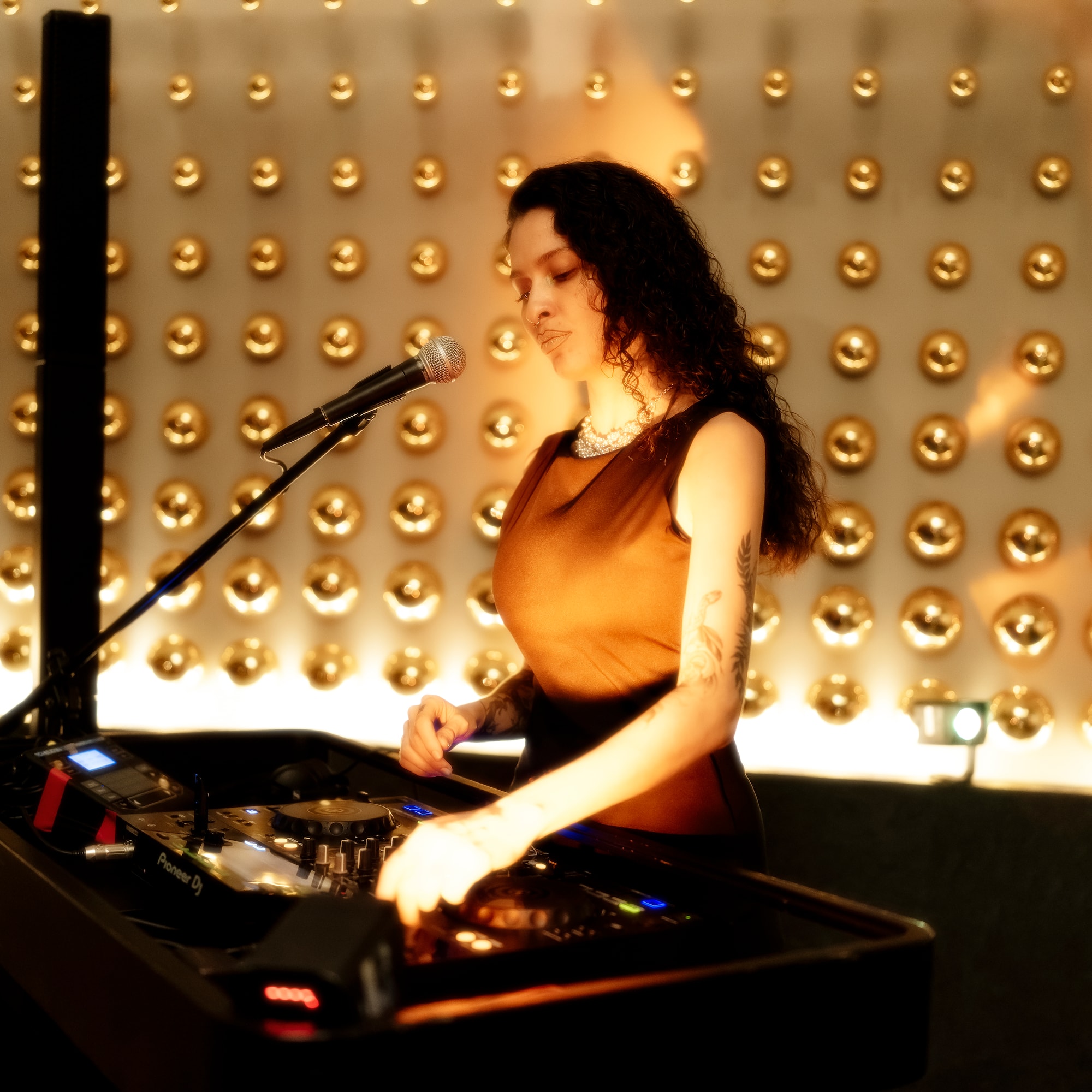 a woman standing in front of a microphone