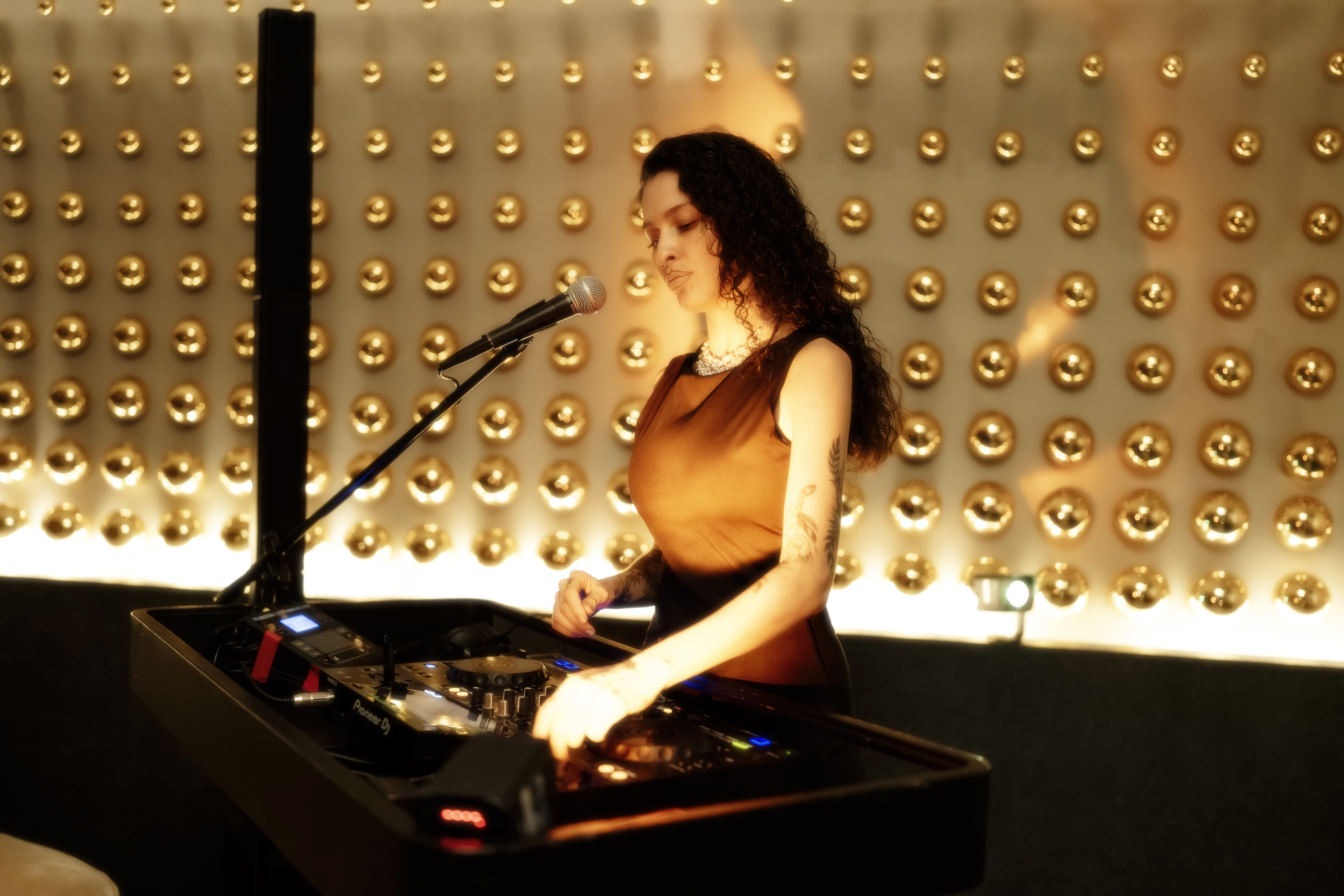 a woman standing in front of a microphone