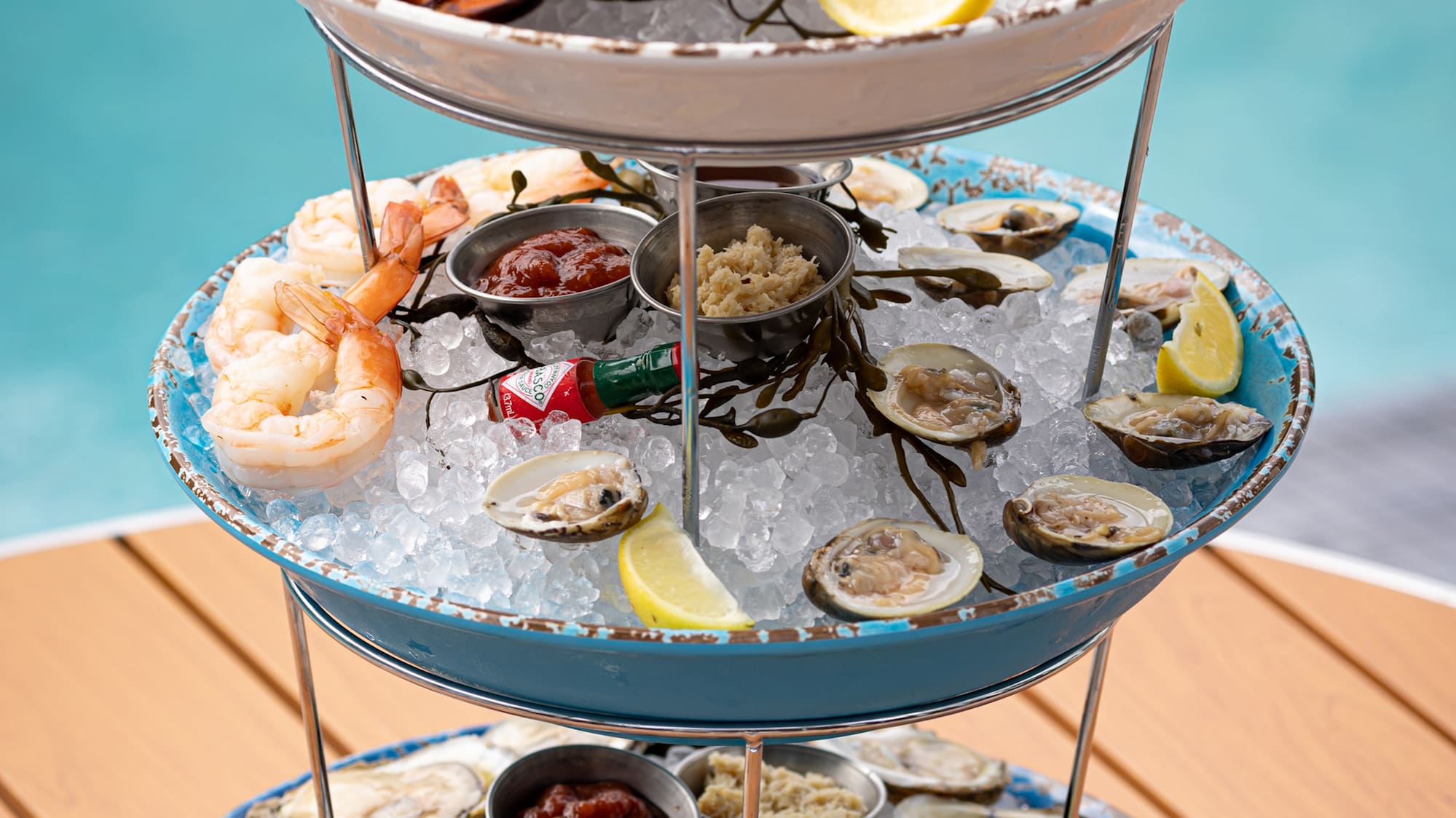 a three tiered tray of seafood