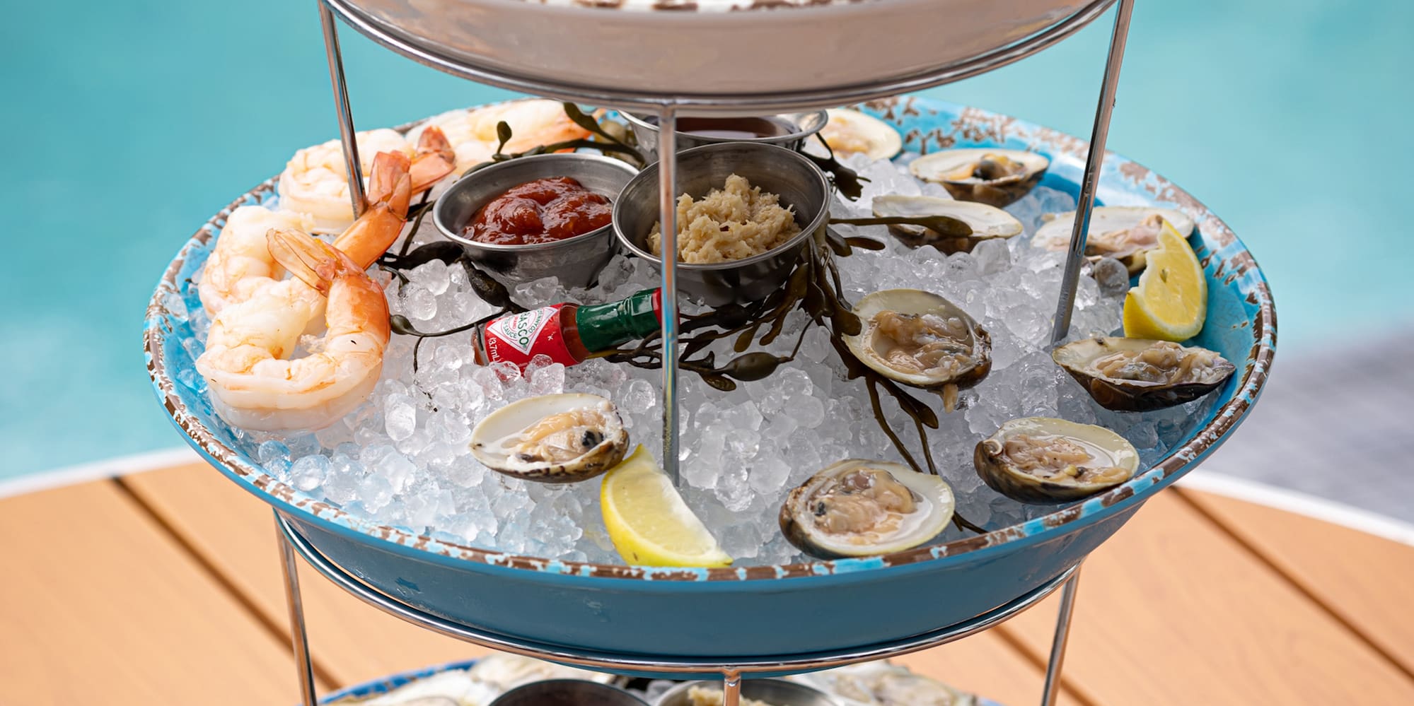 a three tiered tray of seafood