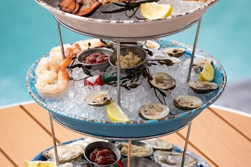 a three tiered tray of seafood