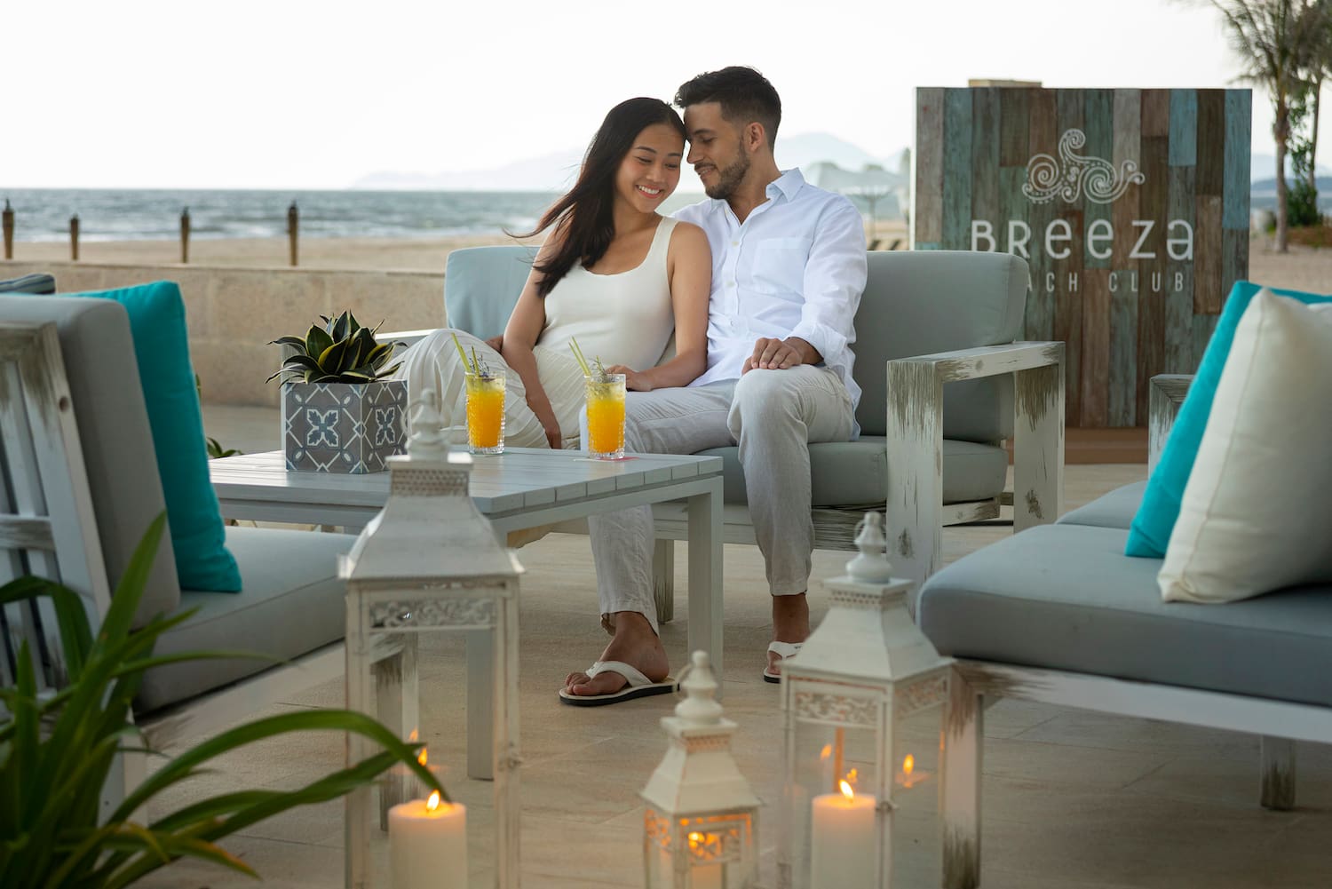 a man and woman sitting on a couch