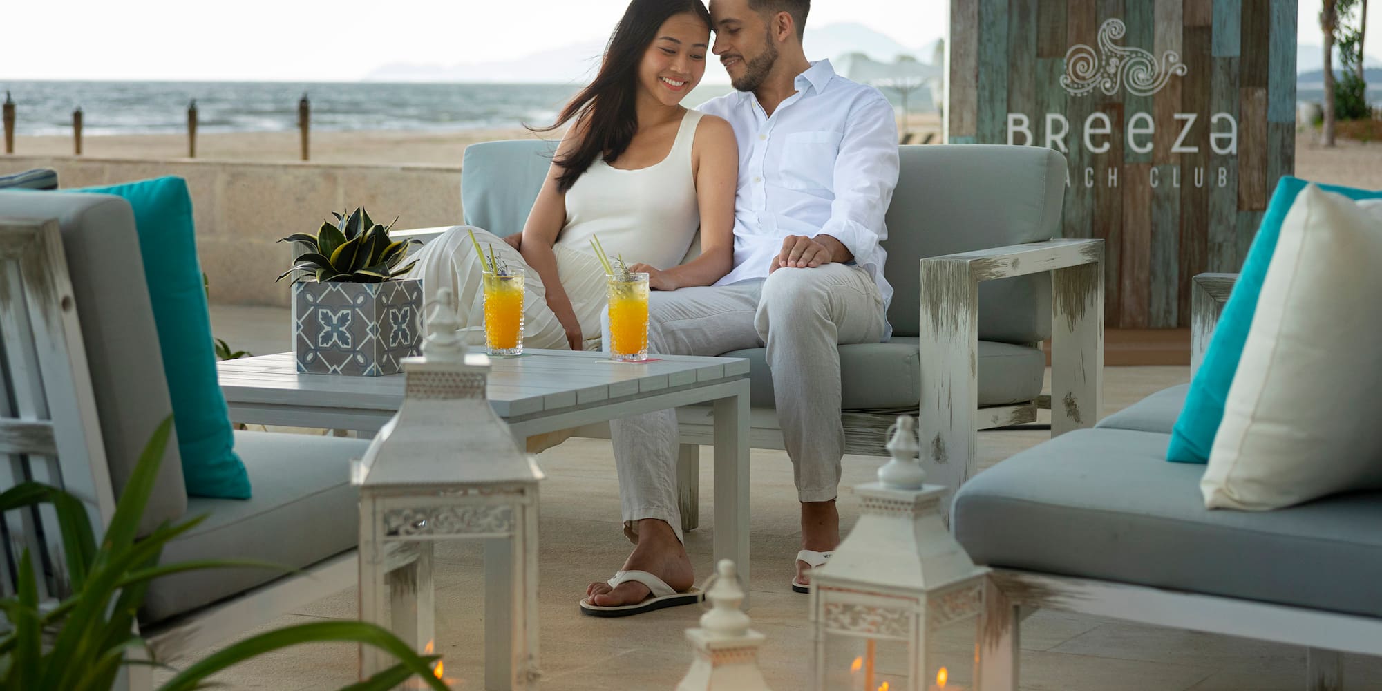 a man and woman sitting on a couch
