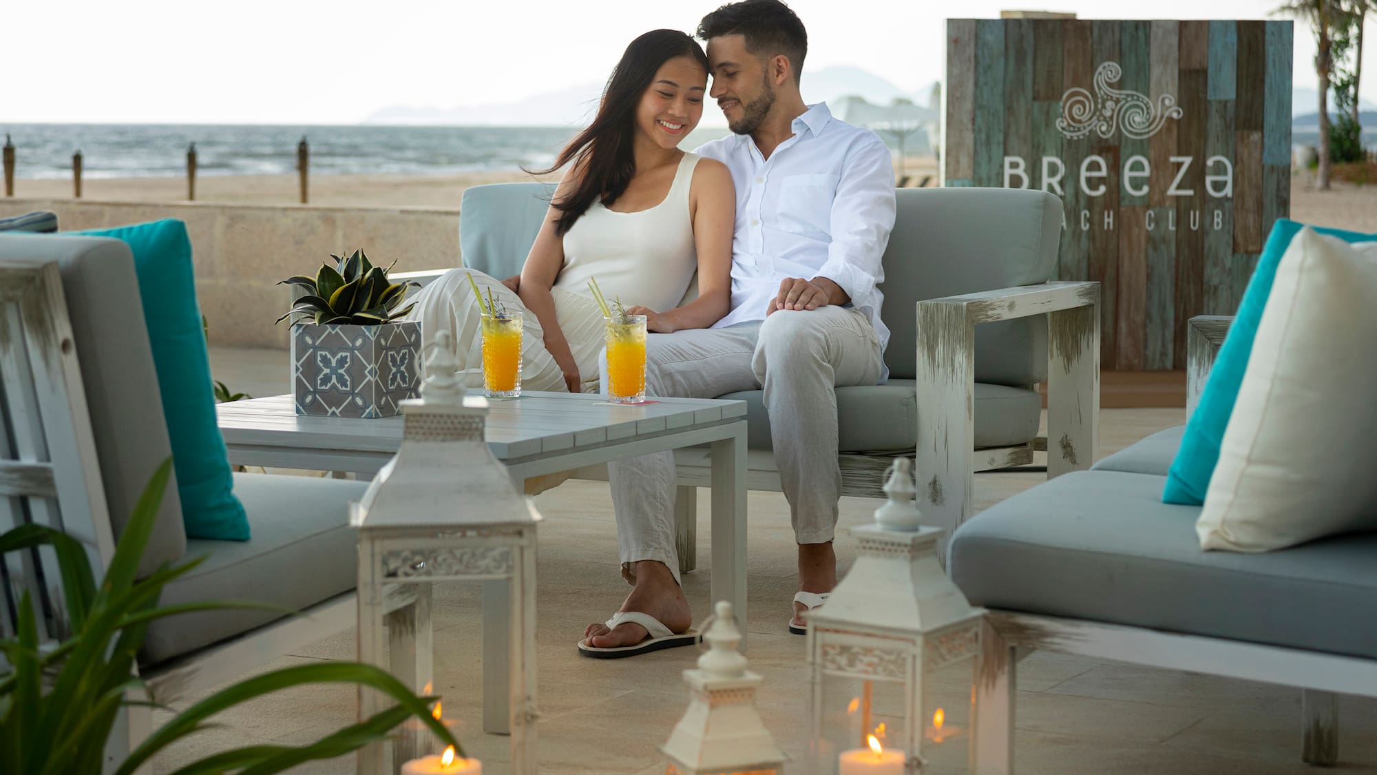 a man and woman sitting on a couch