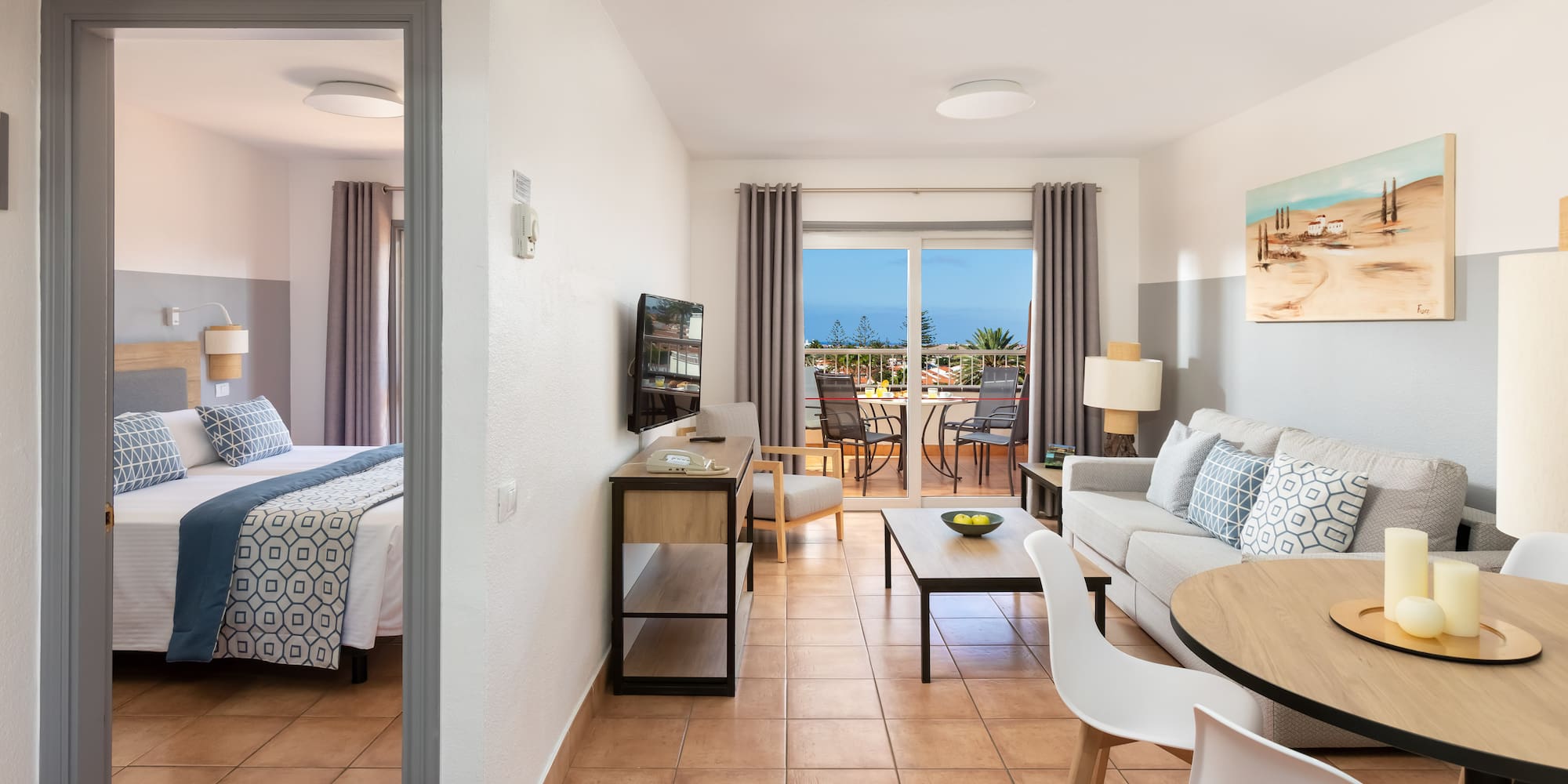 a room with a bed and a television