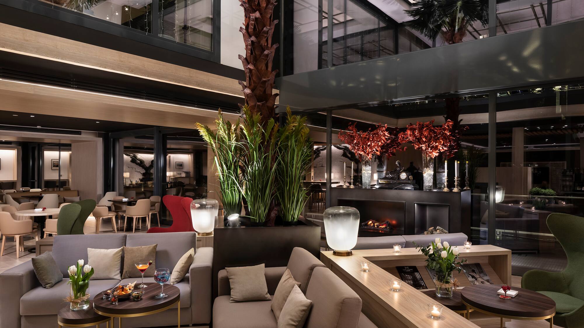 a room with a large tree and a couch