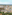 a city with many buildings and trees