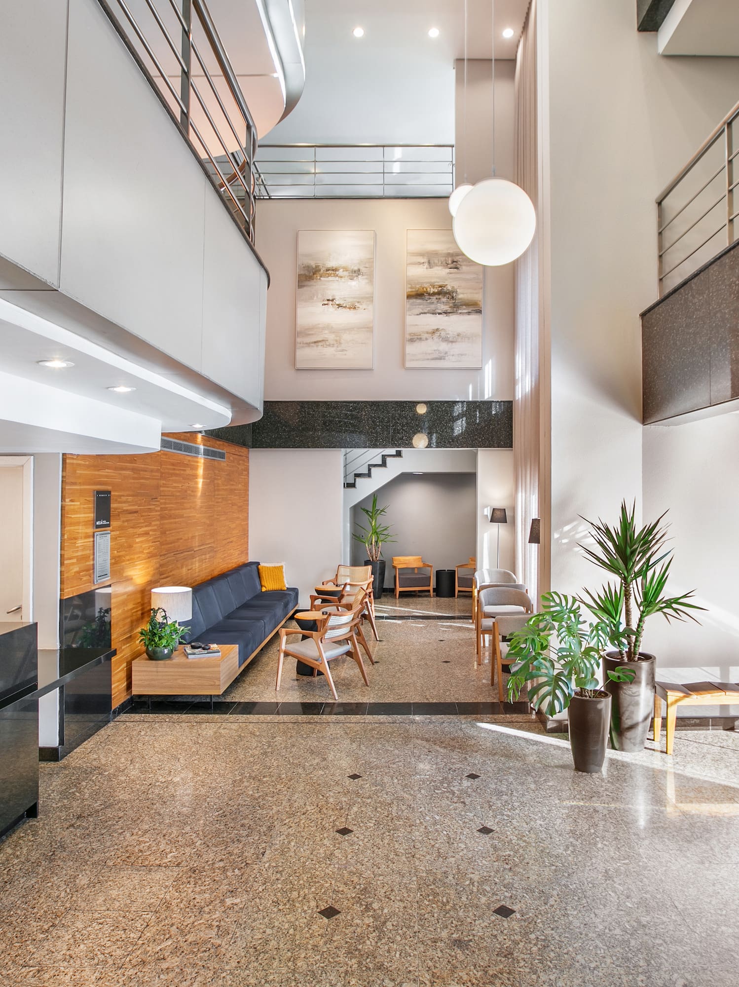 a lobby with a couch and a sofa