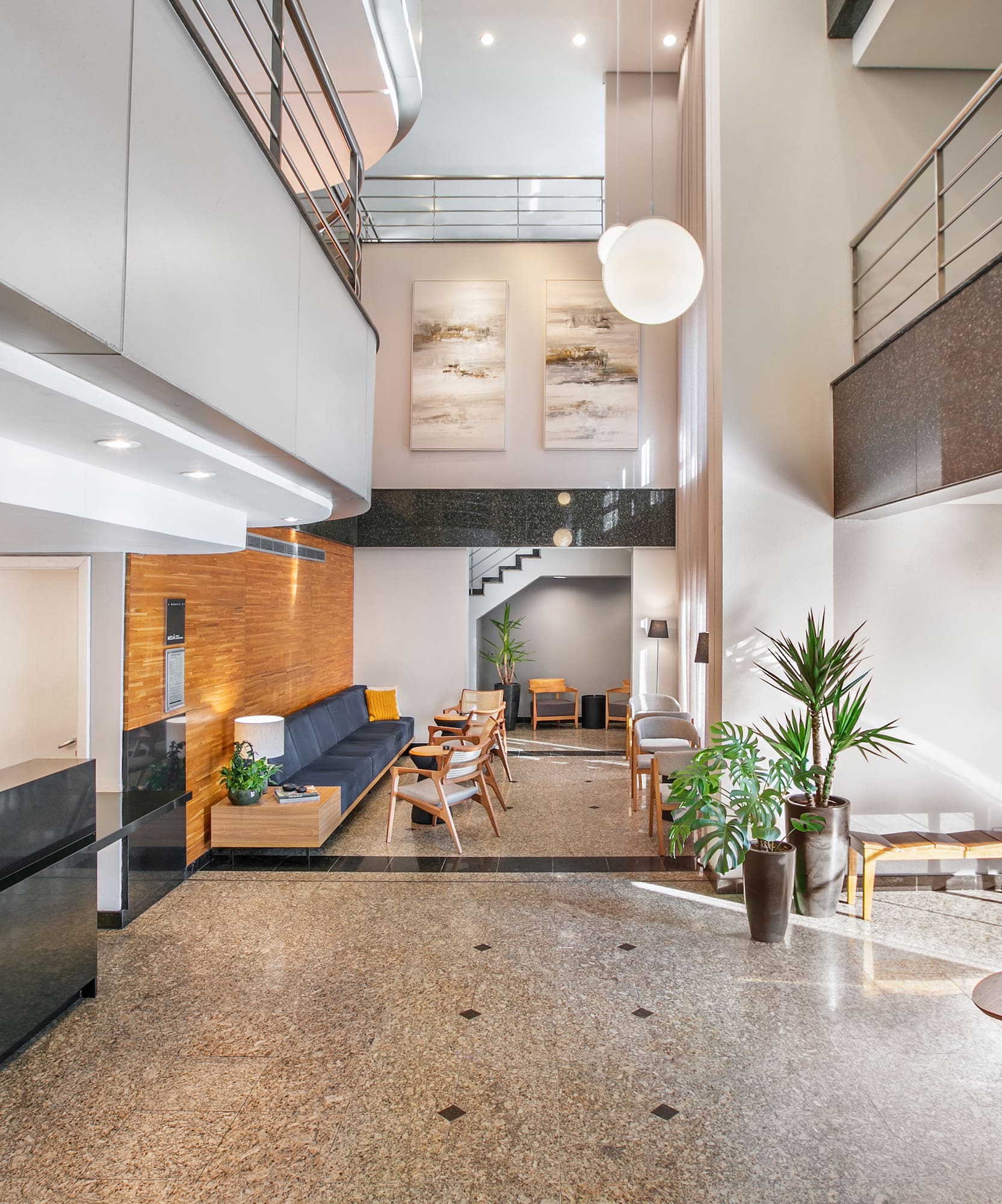 a lobby with a couch and a sofa