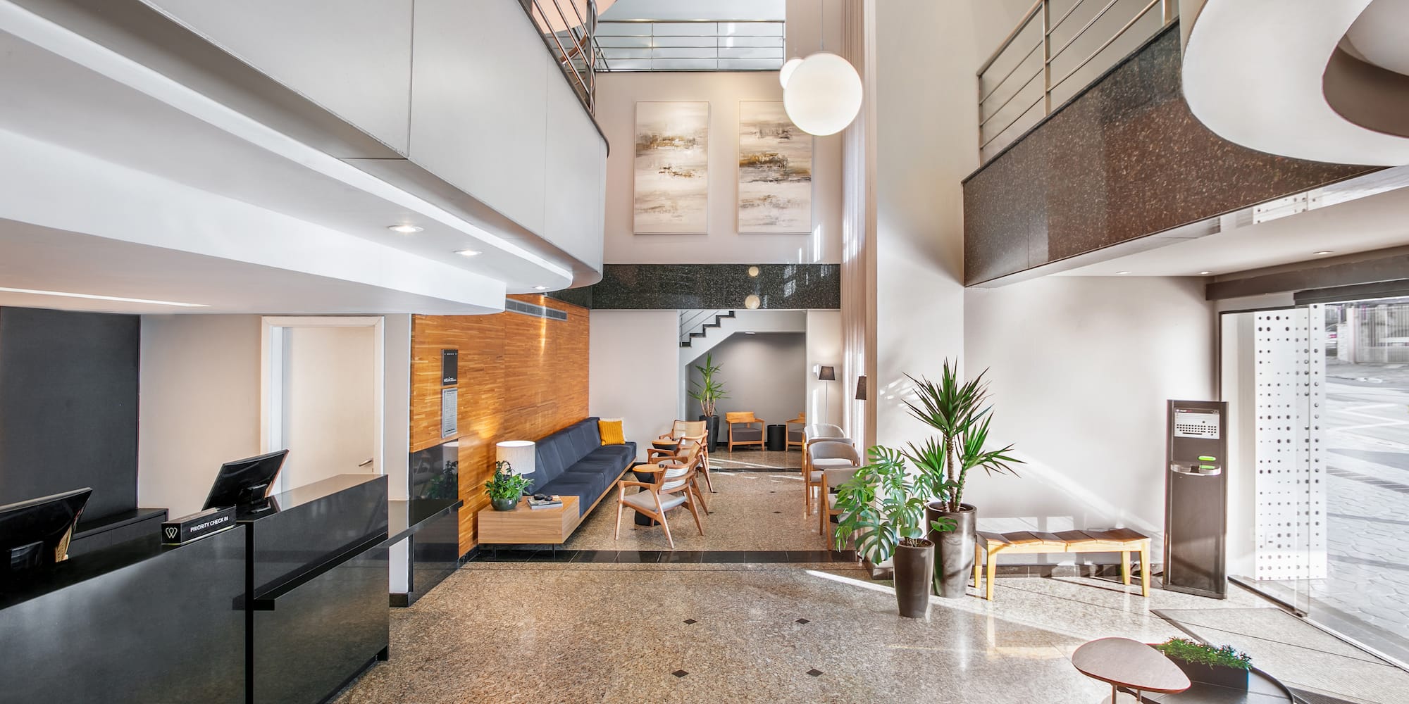 a lobby with a couch and a sofa